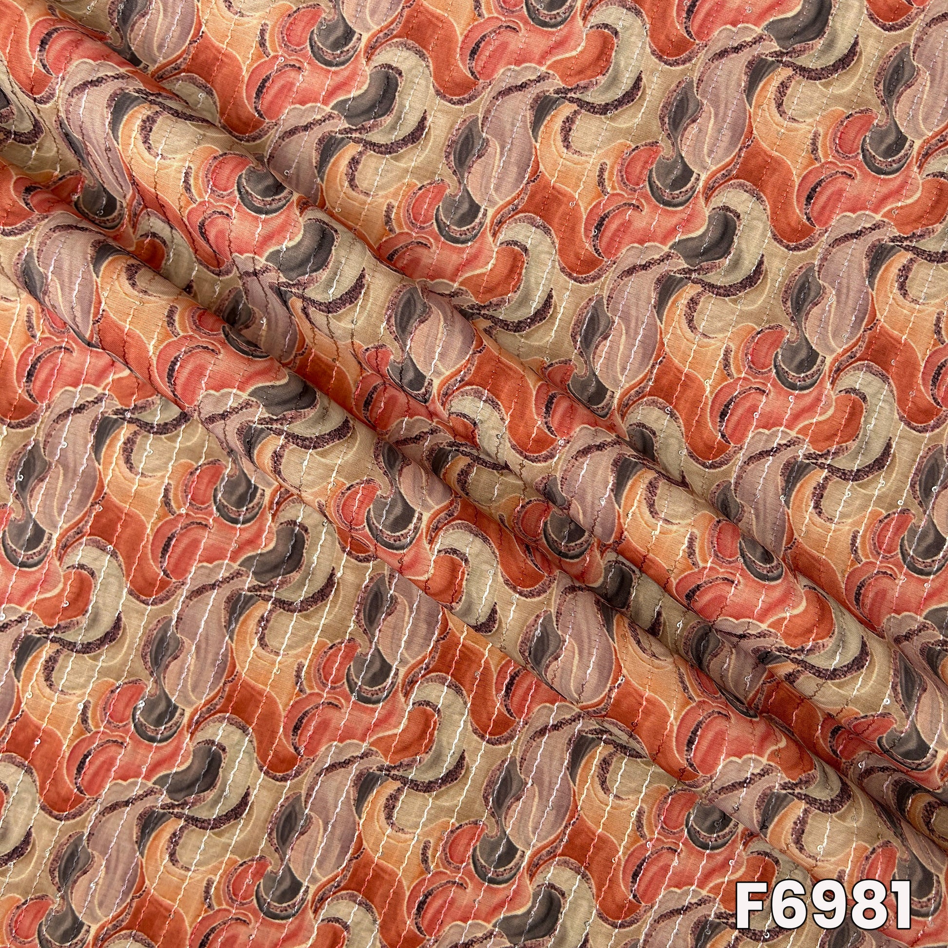 Draped F6981 semi silk fabric highlighting smooth folds, subtle shimmer and premium festive texture