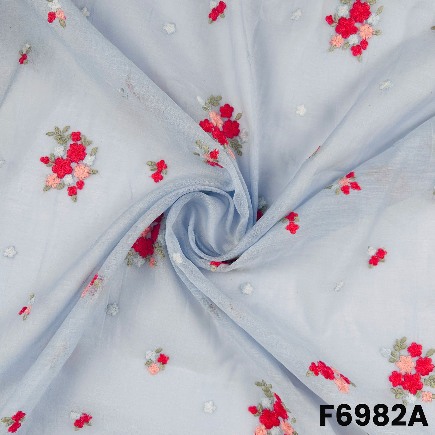 Close view of F6982A showing fine flower placement, light fabric texture and graceful embroidered details