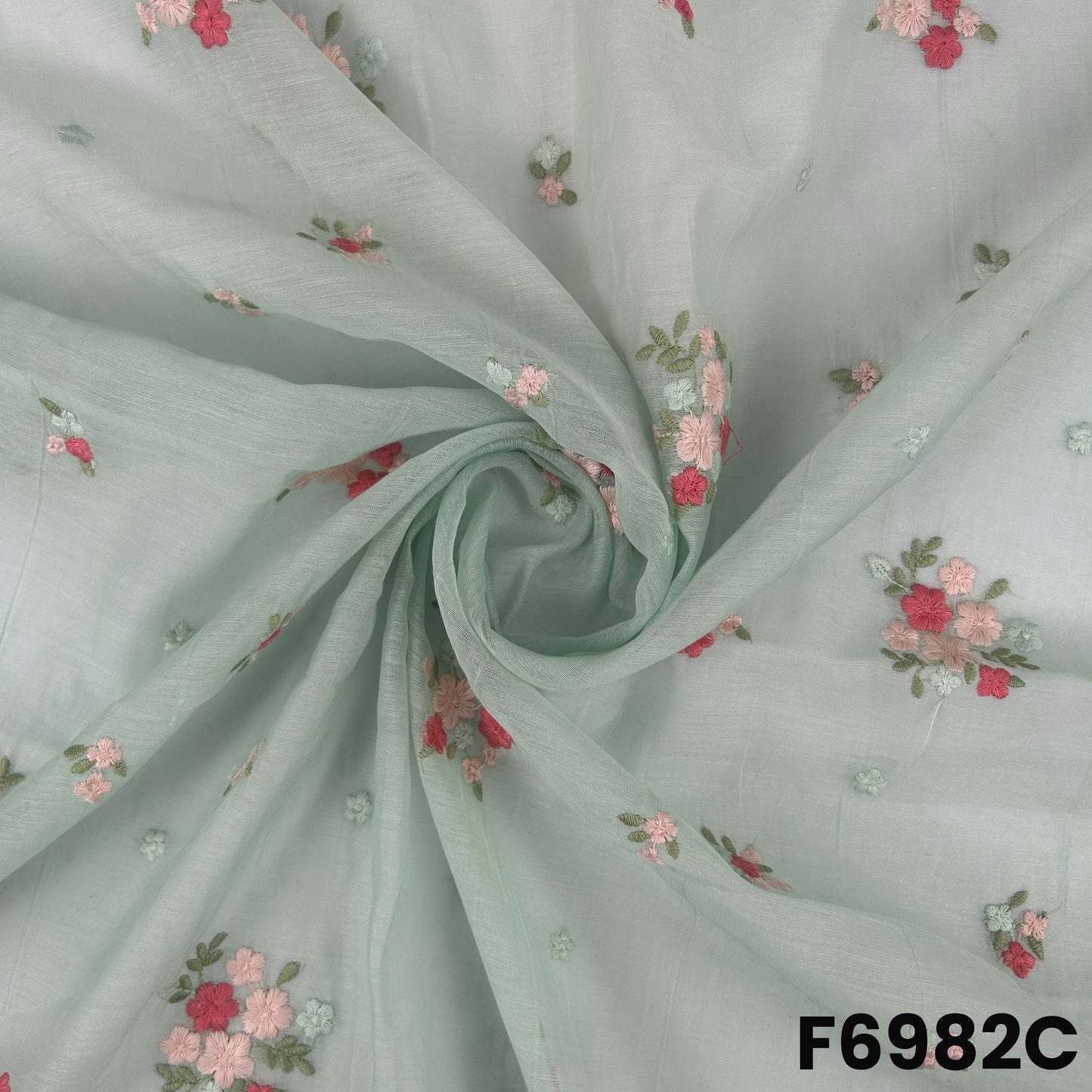Detailed mint F6982C surface showing gentle drape, refined thread motifs and lightweight Chanderi texture