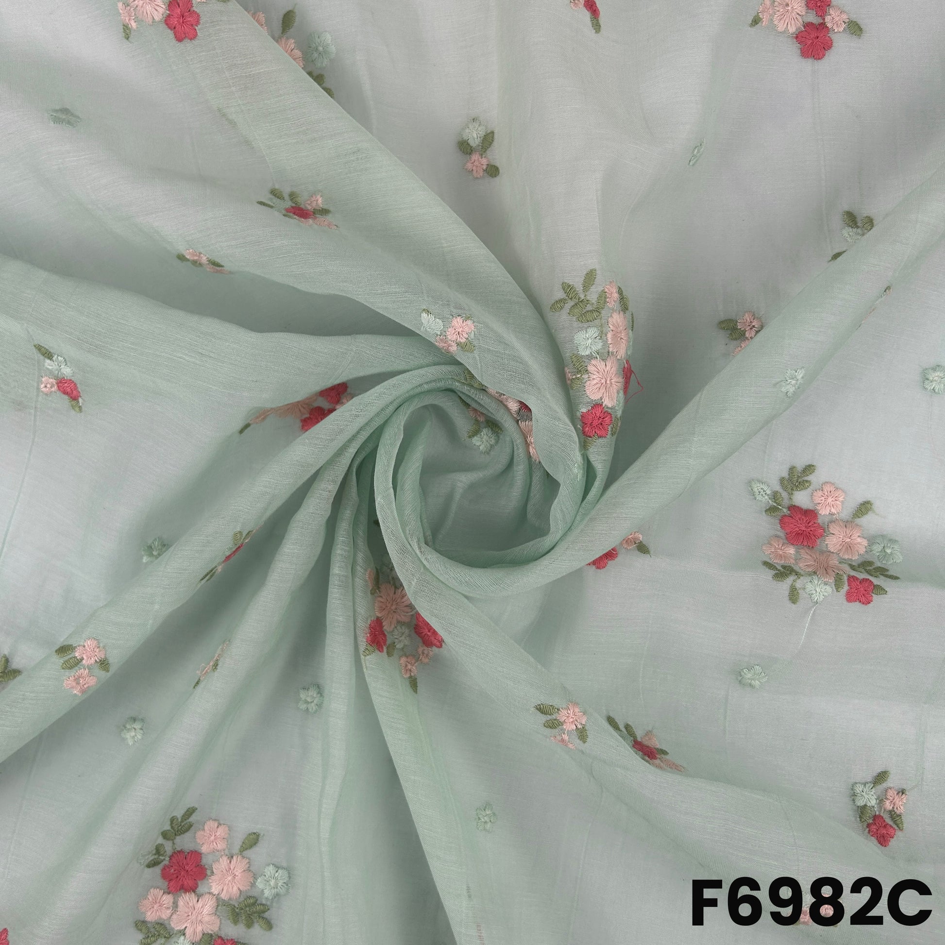 Detailed mint F6982C surface showing gentle drape, refined thread motifs and lightweight Chanderi texture