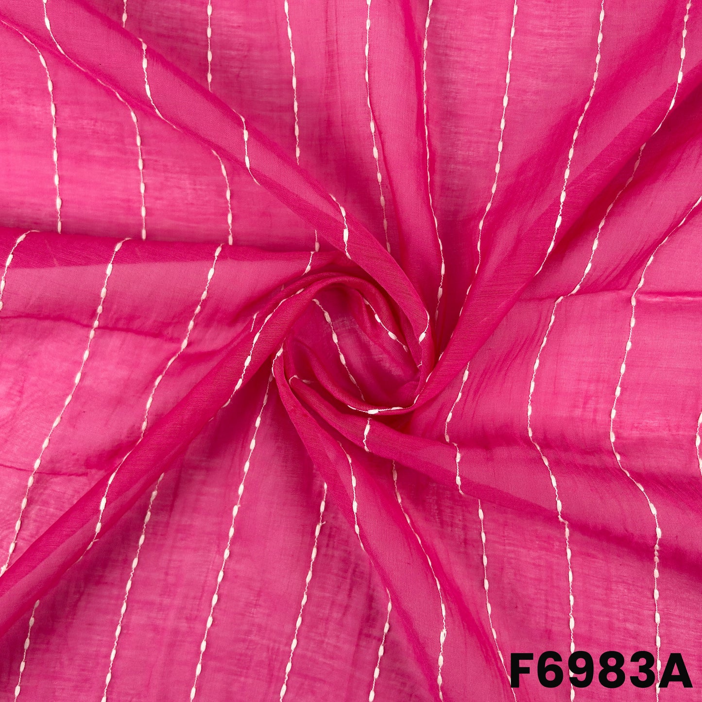 Close view of F6983A showing neat stitched stripe work, smooth folds and subtle woven texture
