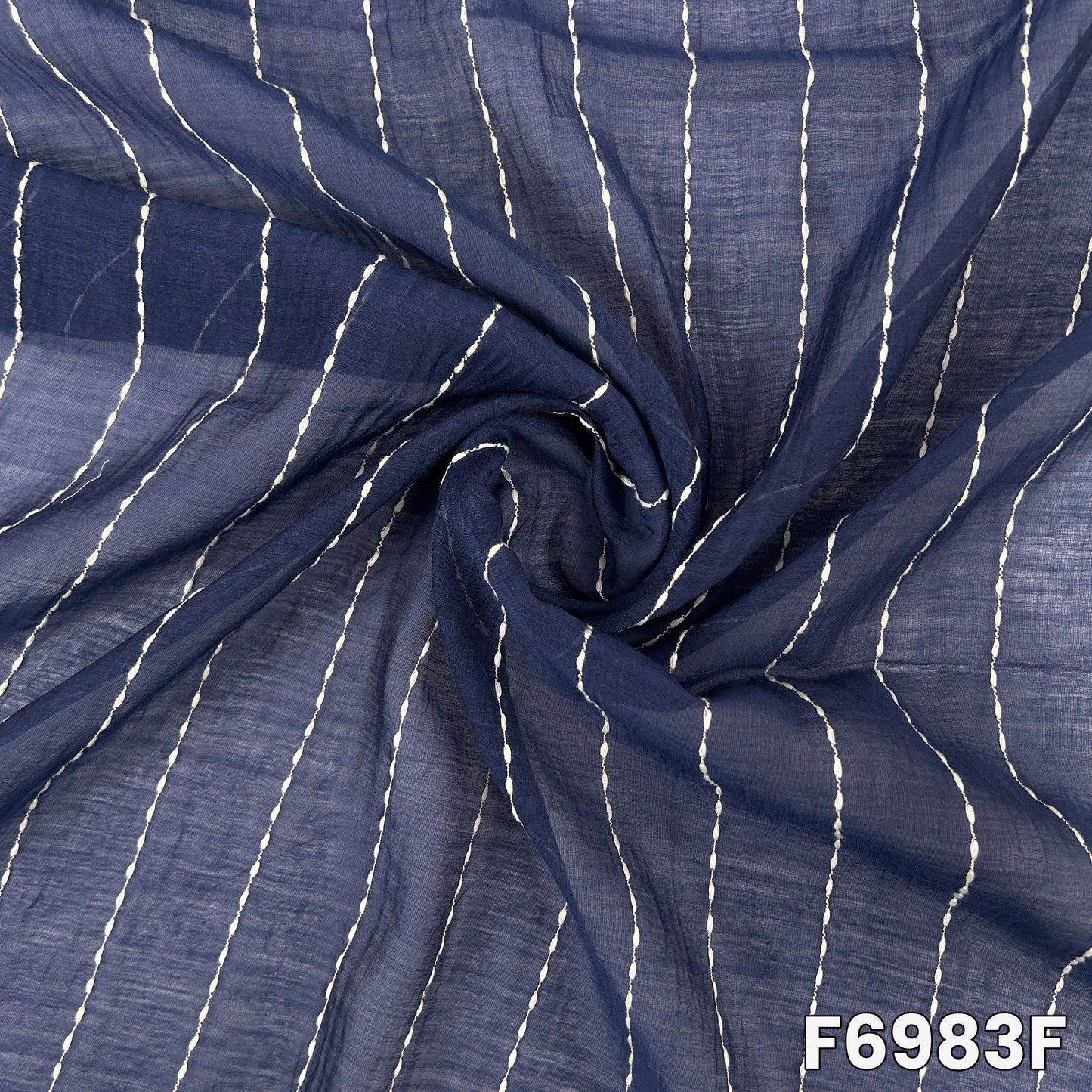 Detailed navy F6983F fabric image showing crisp thread lines, dark woven texture and graceful drape