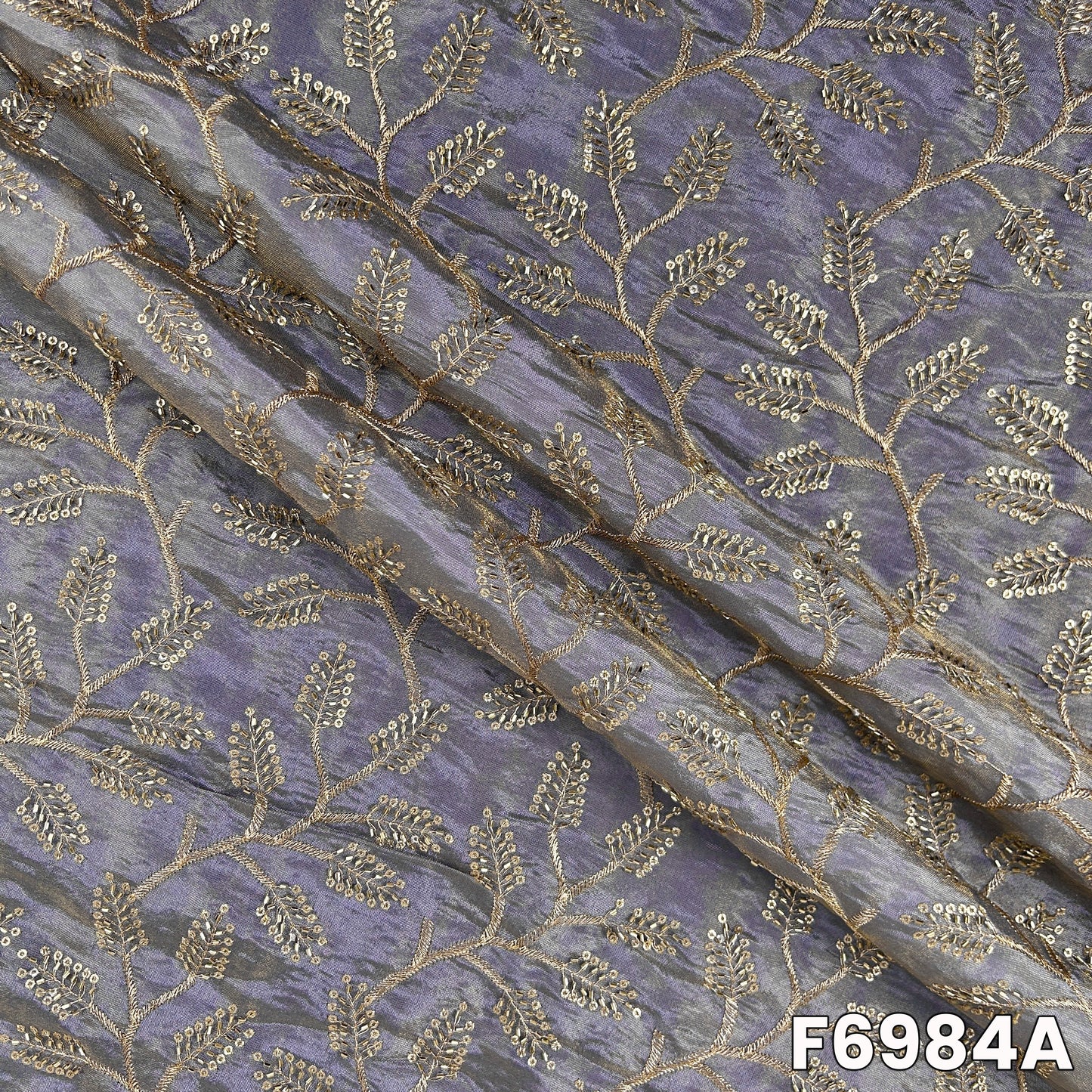 Close view of F6984A showing metallic zari vines, cut dana sparkle and smooth festive texture
