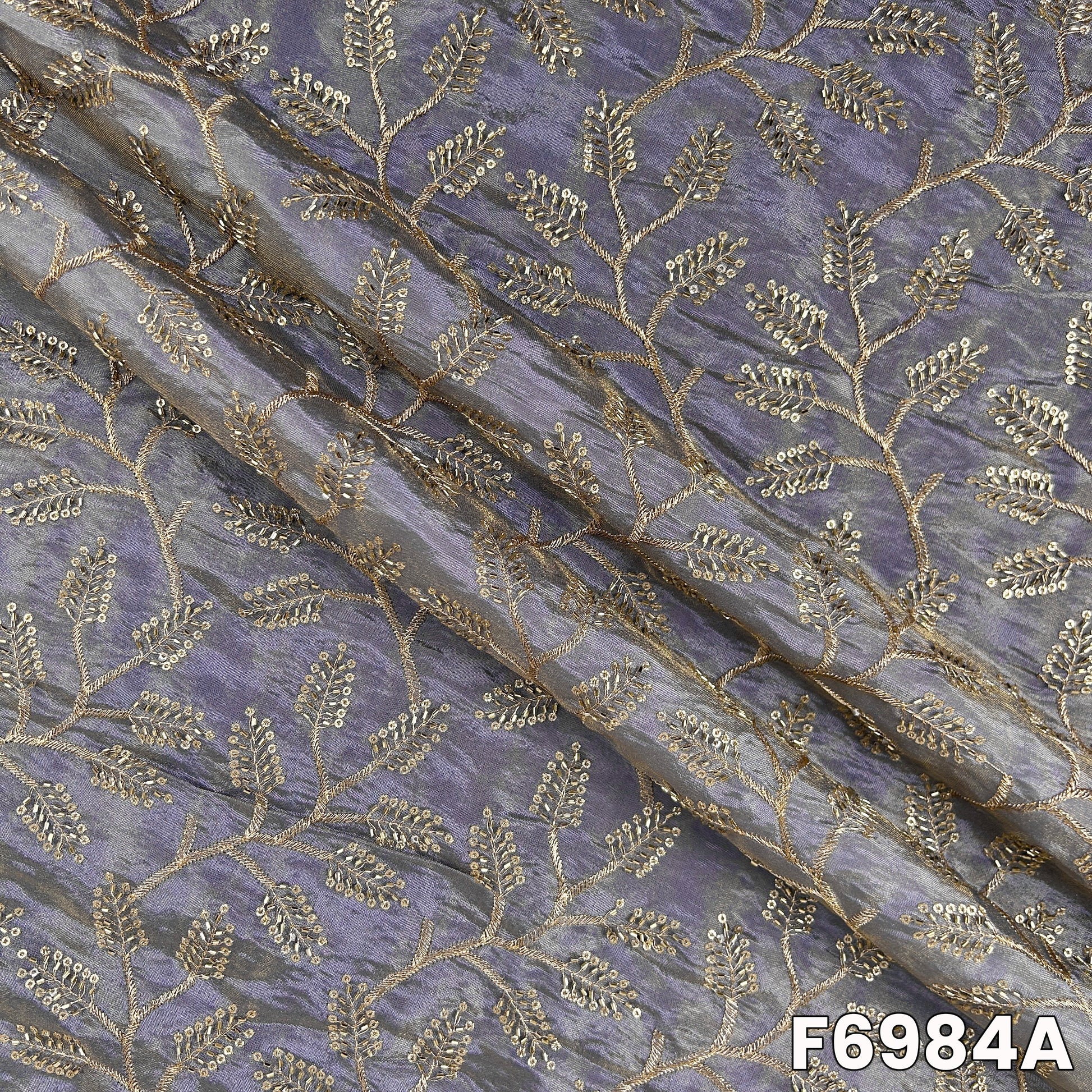 Close view of F6984A showing metallic zari vines, cut dana sparkle and smooth festive texture