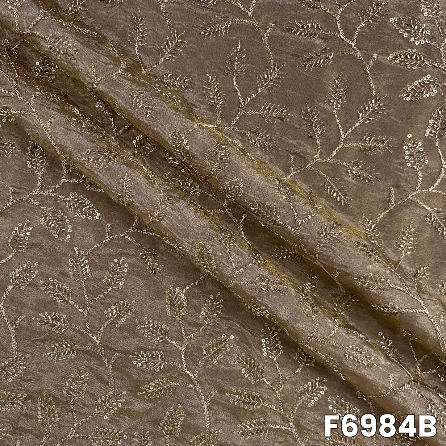 Draped F6984B fabric highlighting bronze shimmer, fine embroidery placement and graceful folds