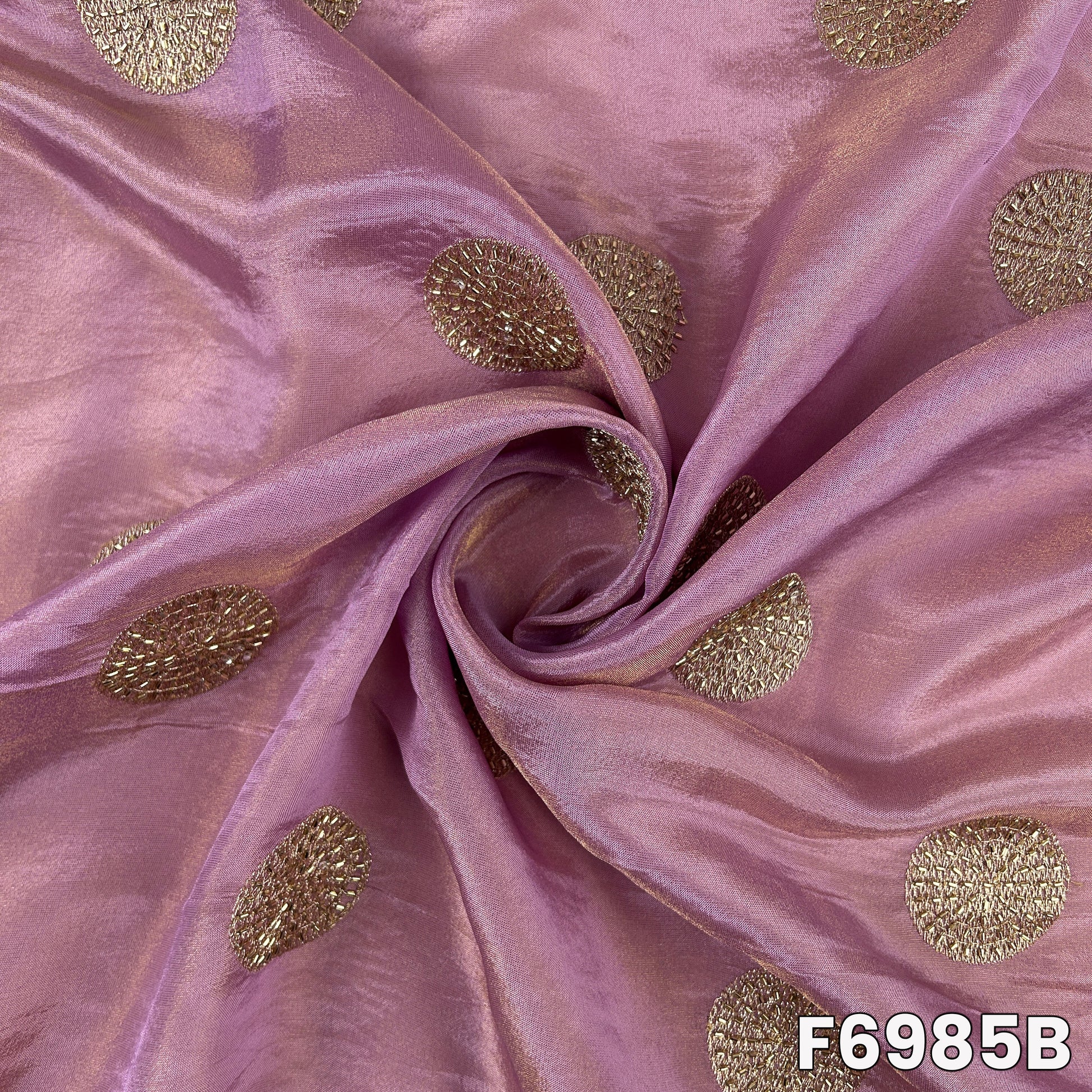 Close view of F6985B highlighting purple sheen, cut dana texture and smooth festive drape