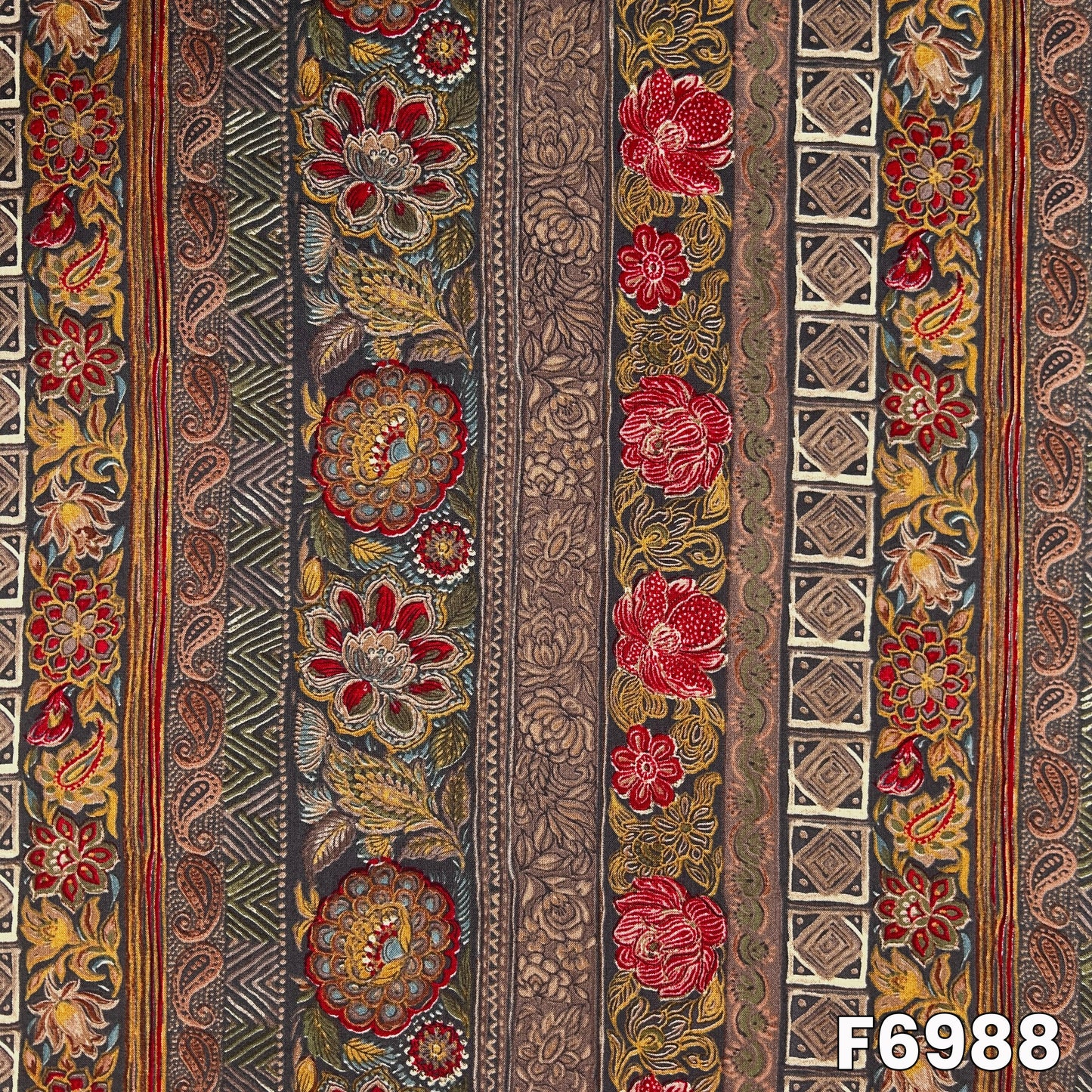 Close pattern view of F6988 showing red flowers, paisley elements and antique-inspired decorative panels