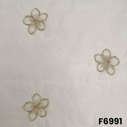 Close pattern view of F6991 highlighting floral butti design, fine zari outlines and subtle cut dana texture