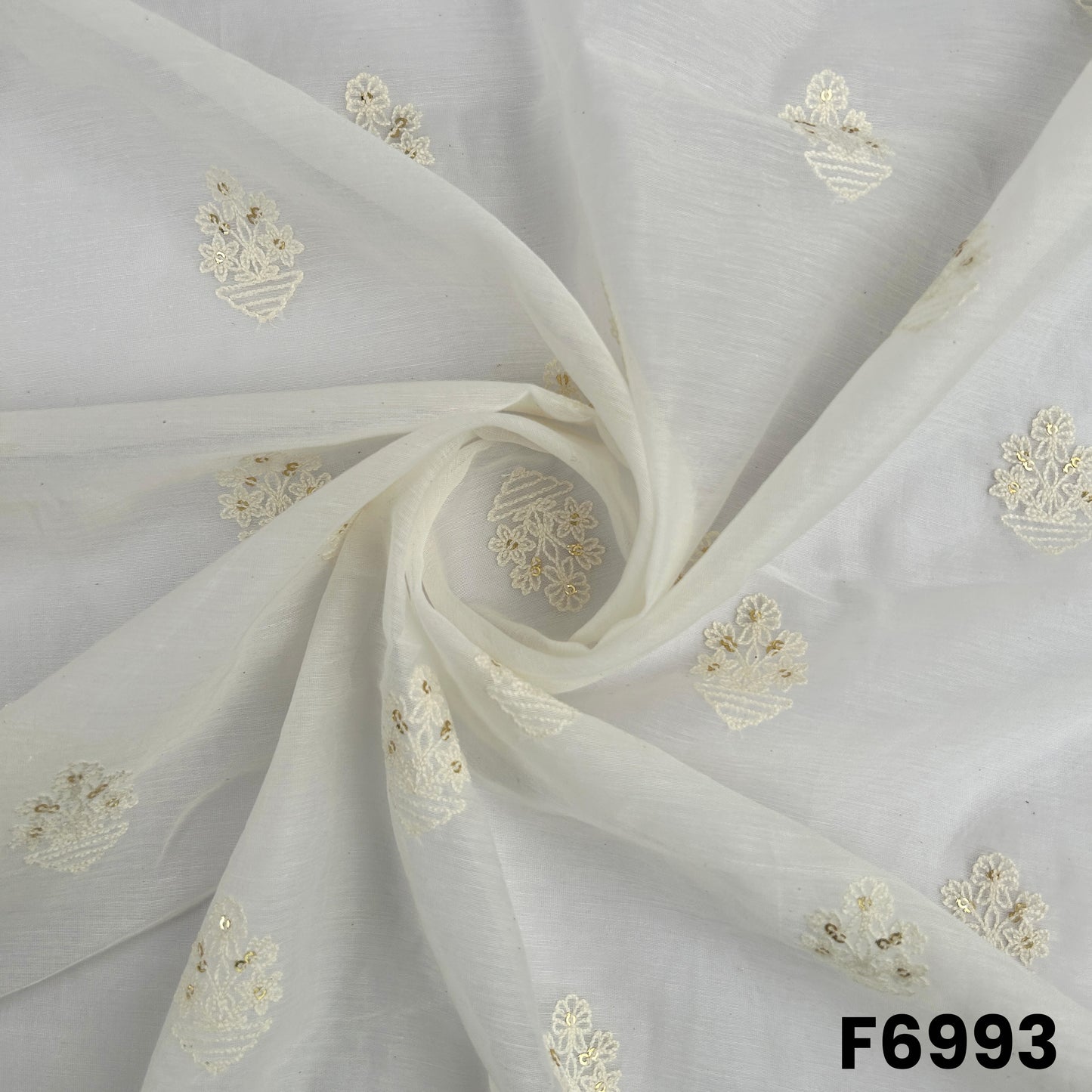 Draped F6993 fabric highlighting airy folds, subtle natural sheen and elegant thread sequins detailing
