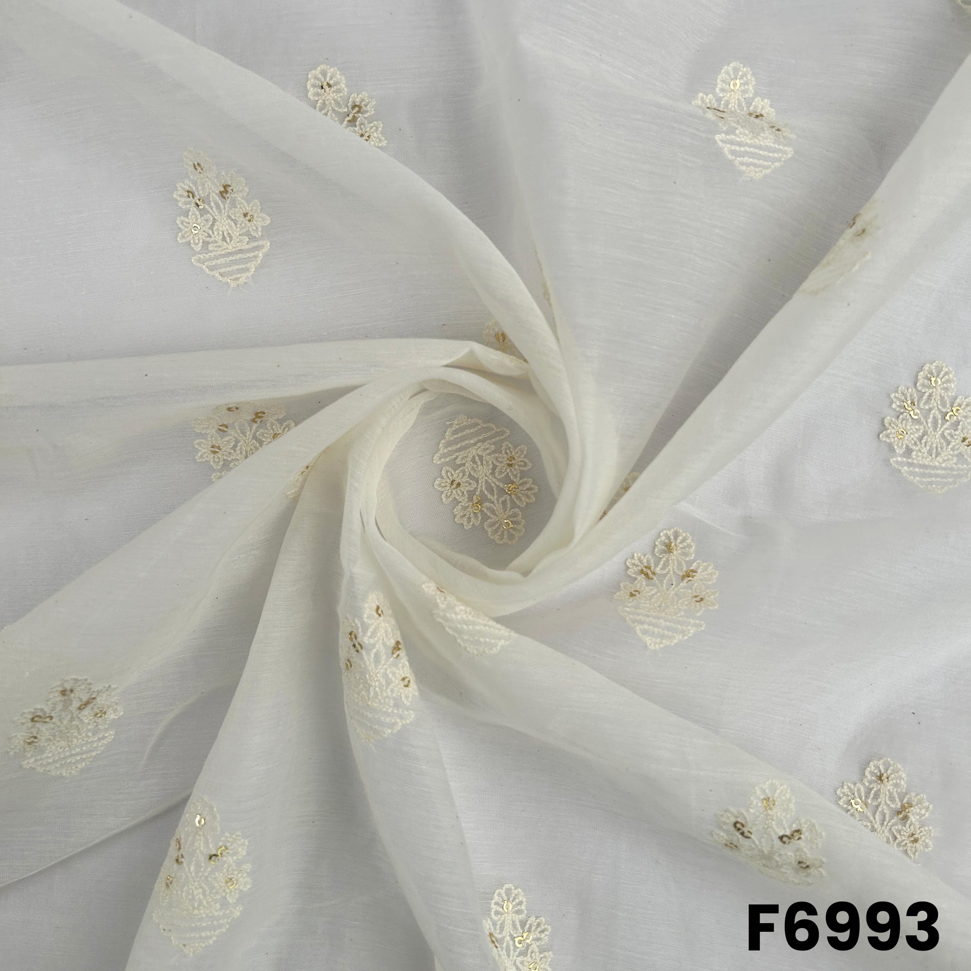 Draped F6993 fabric highlighting airy folds, subtle natural sheen and elegant thread sequins detailing