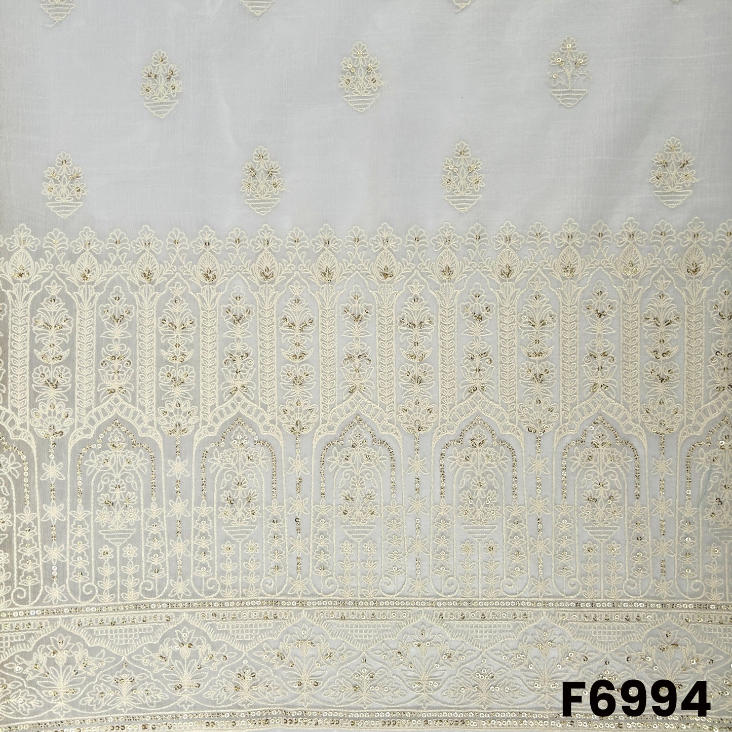 Close view of F6994 highlighting the heavy embroidered border, fine thread detailing and soft golden sequins finish