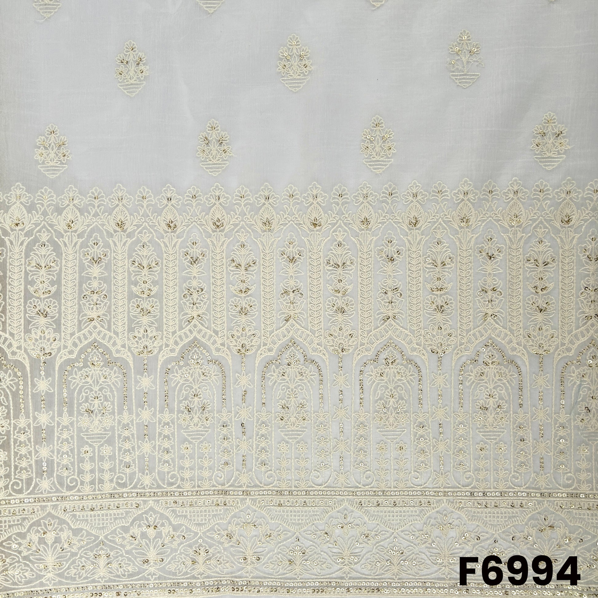 Close view of F6994 highlighting the heavy embroidered border, fine thread detailing and soft golden sequins finish