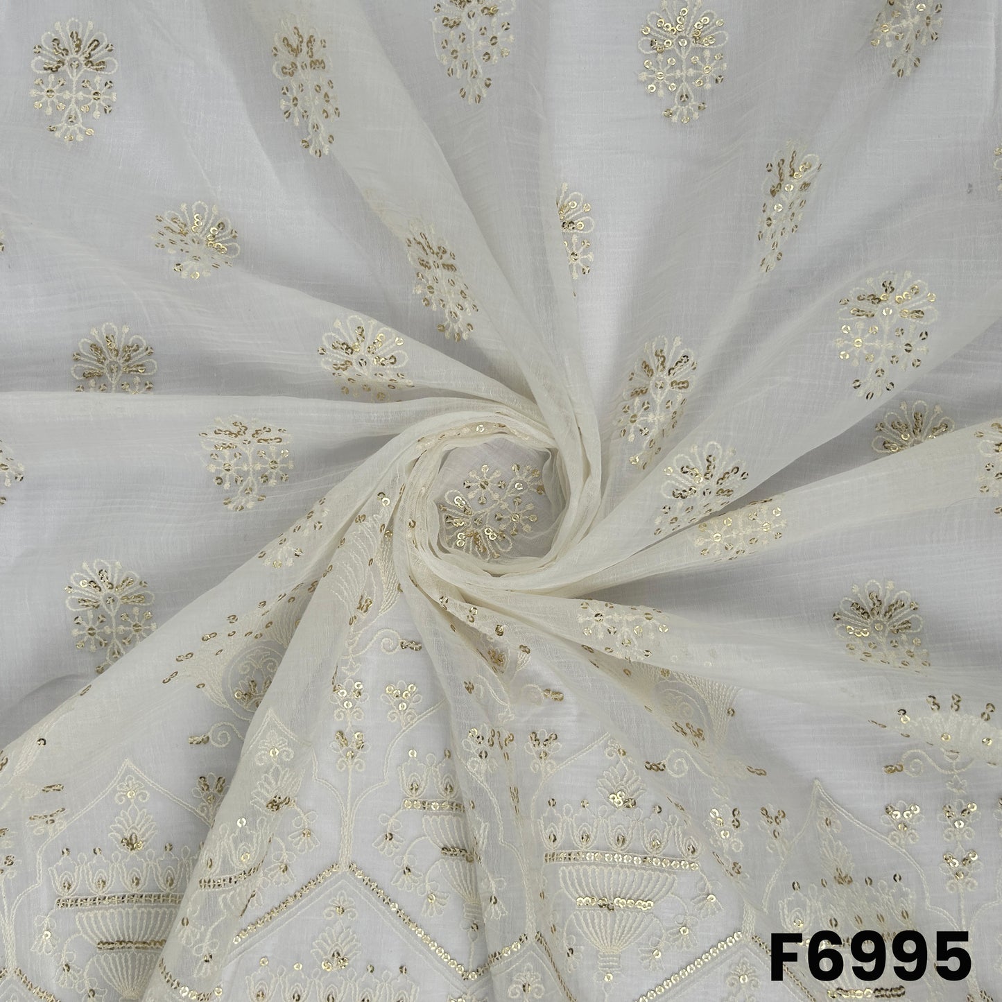 Draped F6995 Chanderi Silk fabric highlighting airy folds, subtle sheen and delicate embroidered butti placement