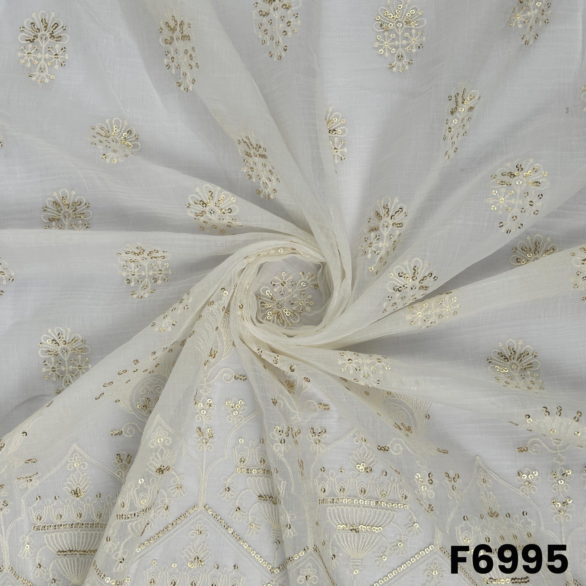 Draped F6995 Chanderi Silk fabric highlighting airy folds, subtle sheen and delicate embroidered butti placement