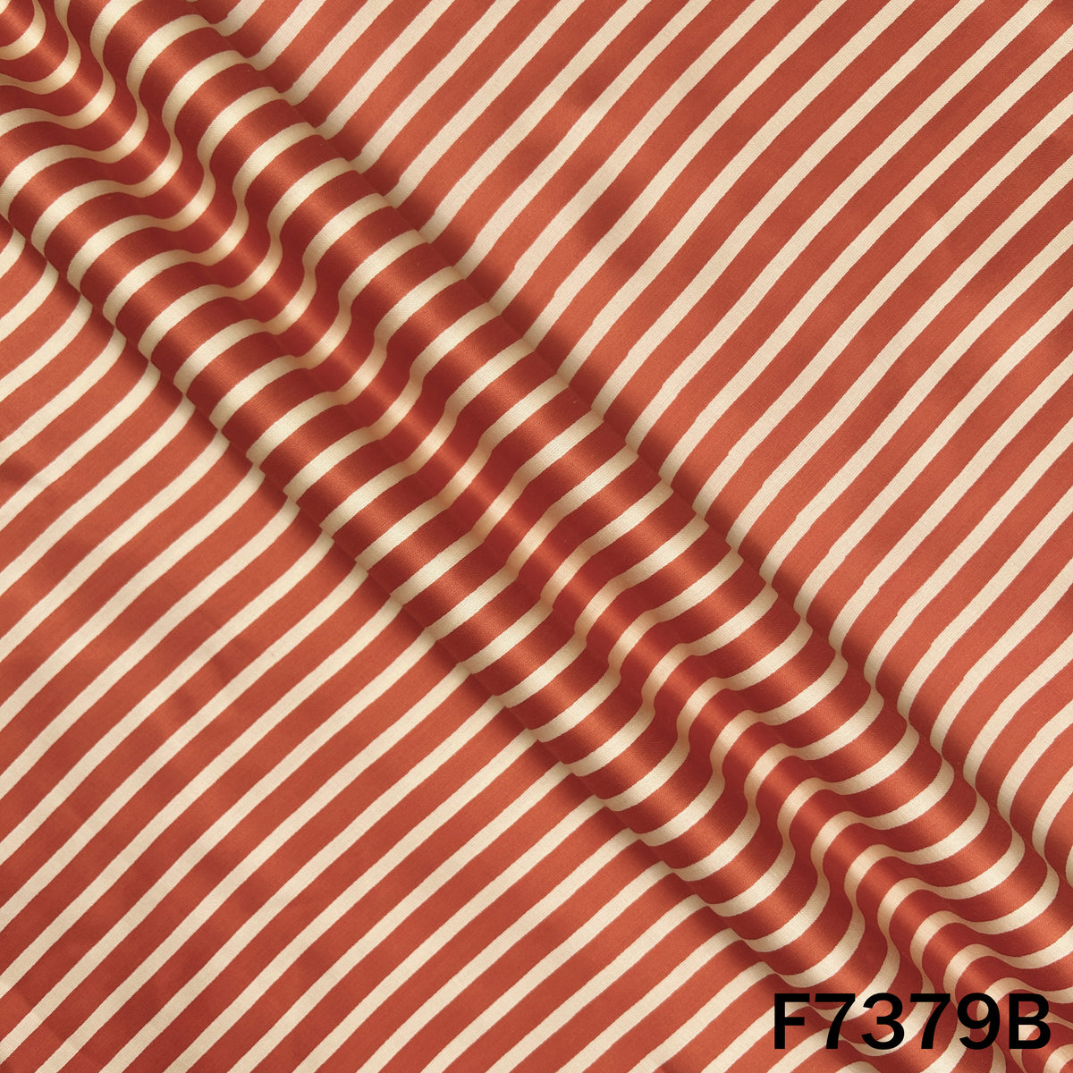 Draped coral modal satin with fine white stripes
