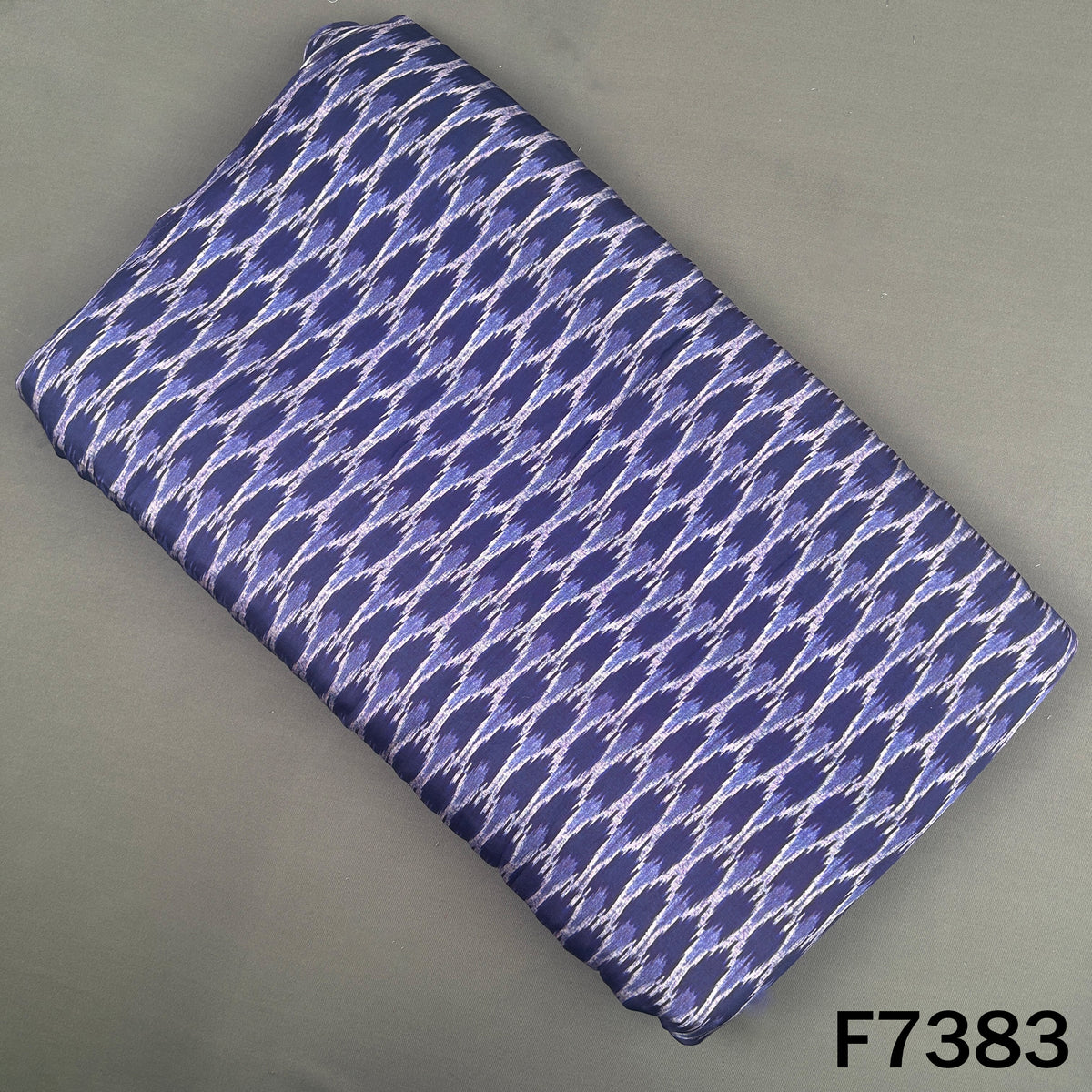 Navy blue modal satin fabric with Ikat wave print