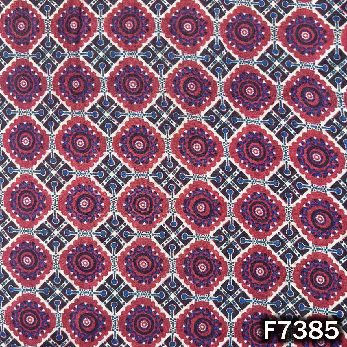 Printed modal satin fabric with circular geometric motifs