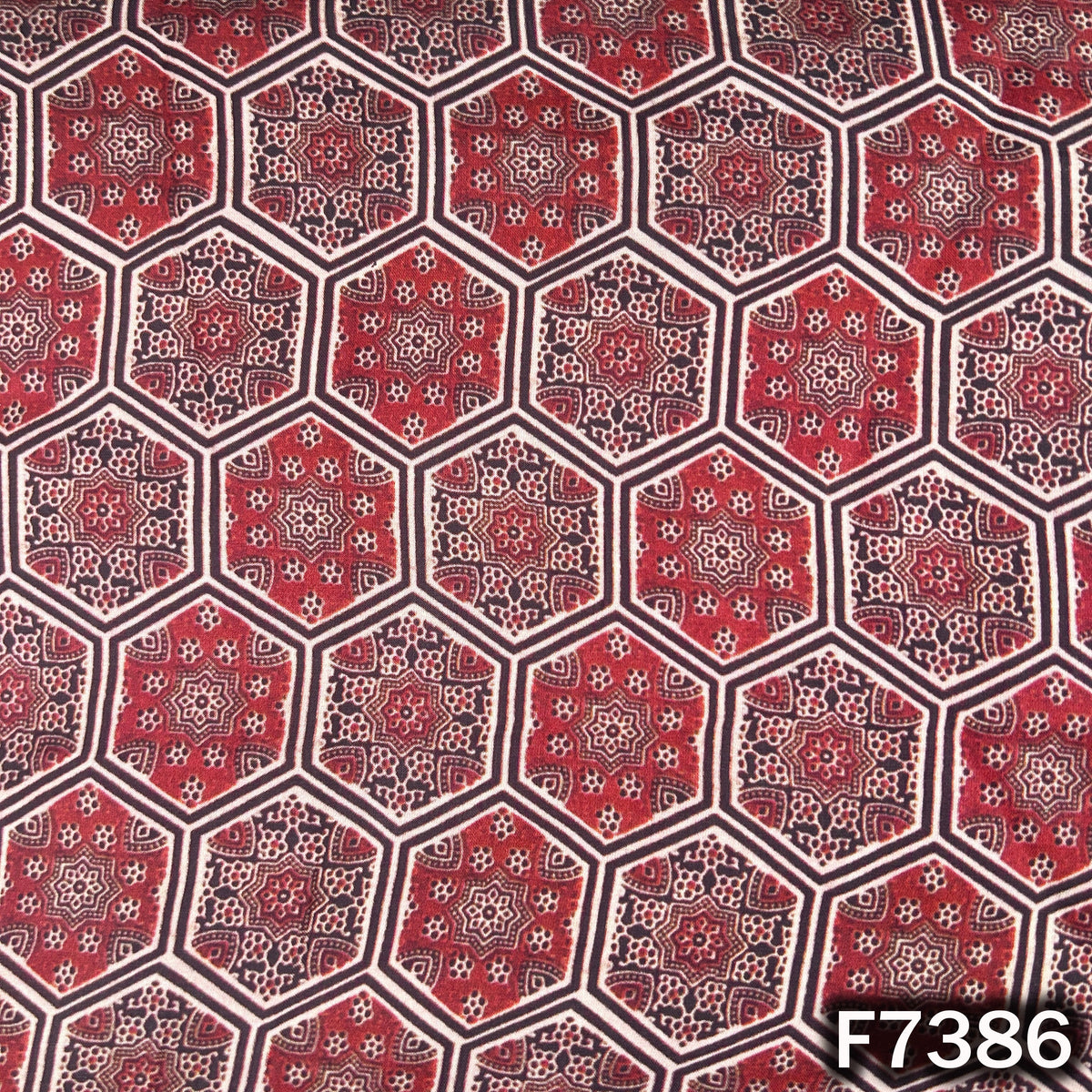 Modal satin fabric with hexagonal Ajrakh inspired motifs