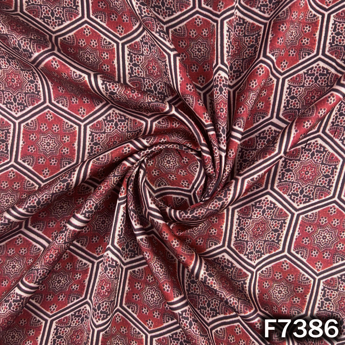 Designer modal satin fabric with maroon geometric pattern
