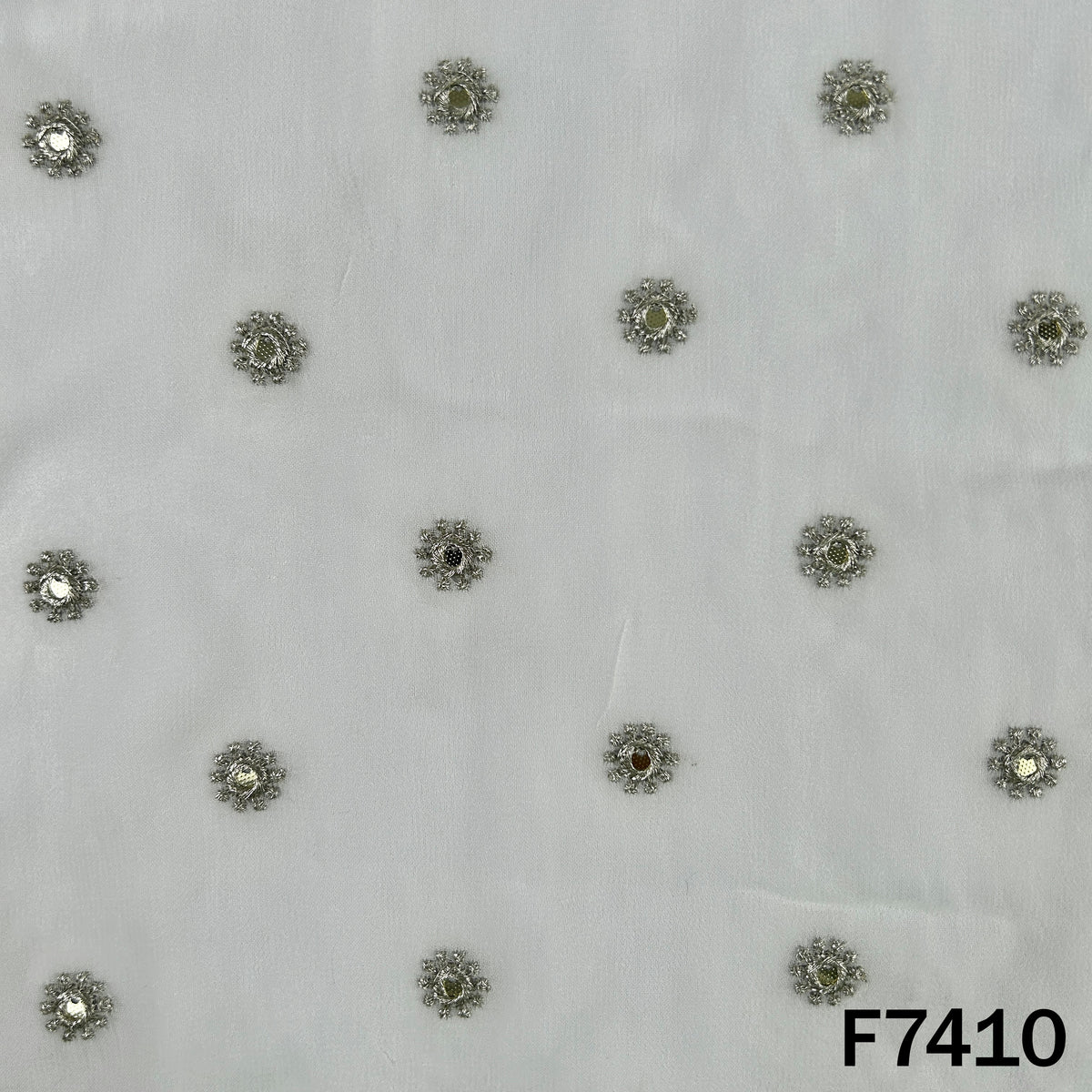 Dyeable georgette fabric with evenly spaced zari motifs