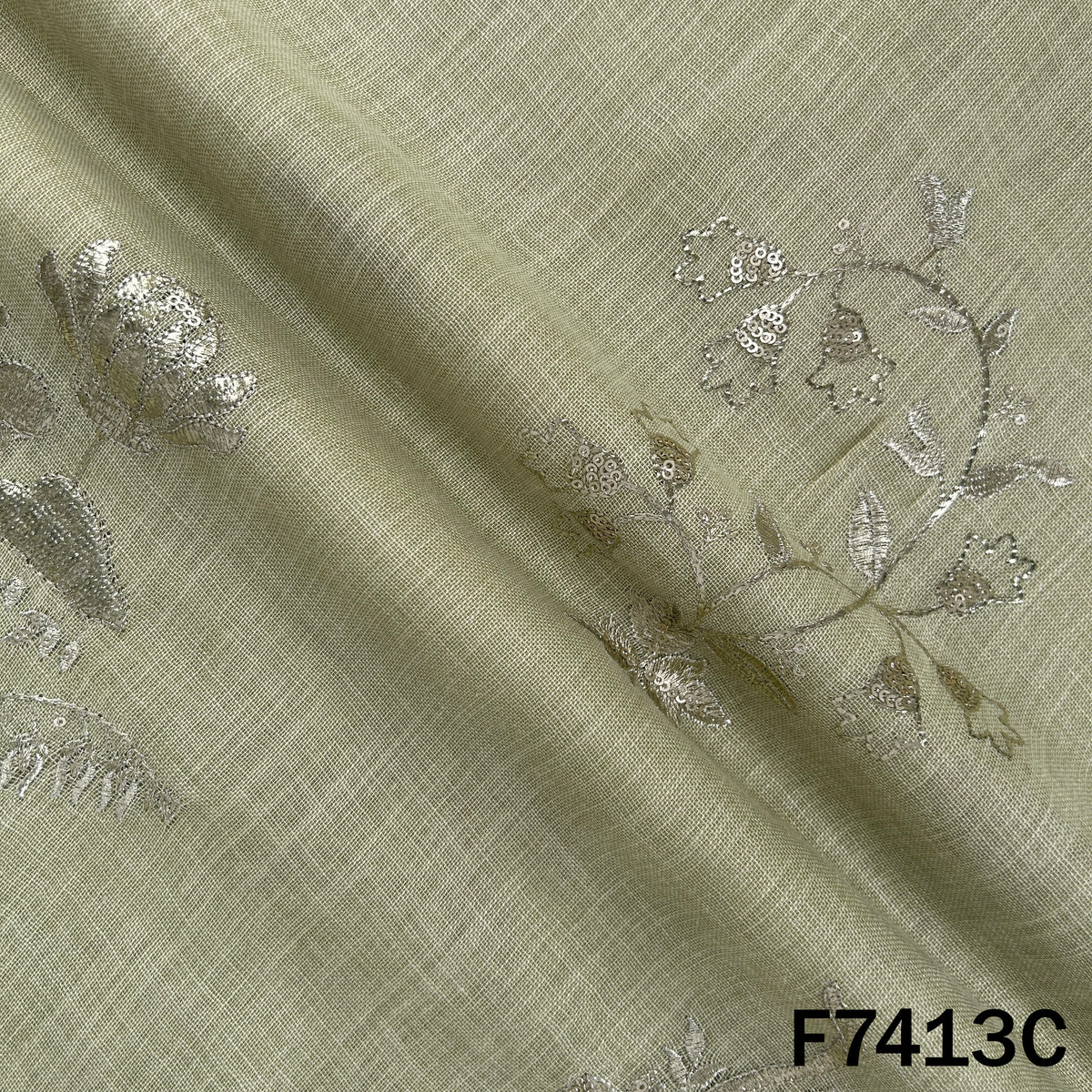 Green designer linen fabric with sequin zari motifs