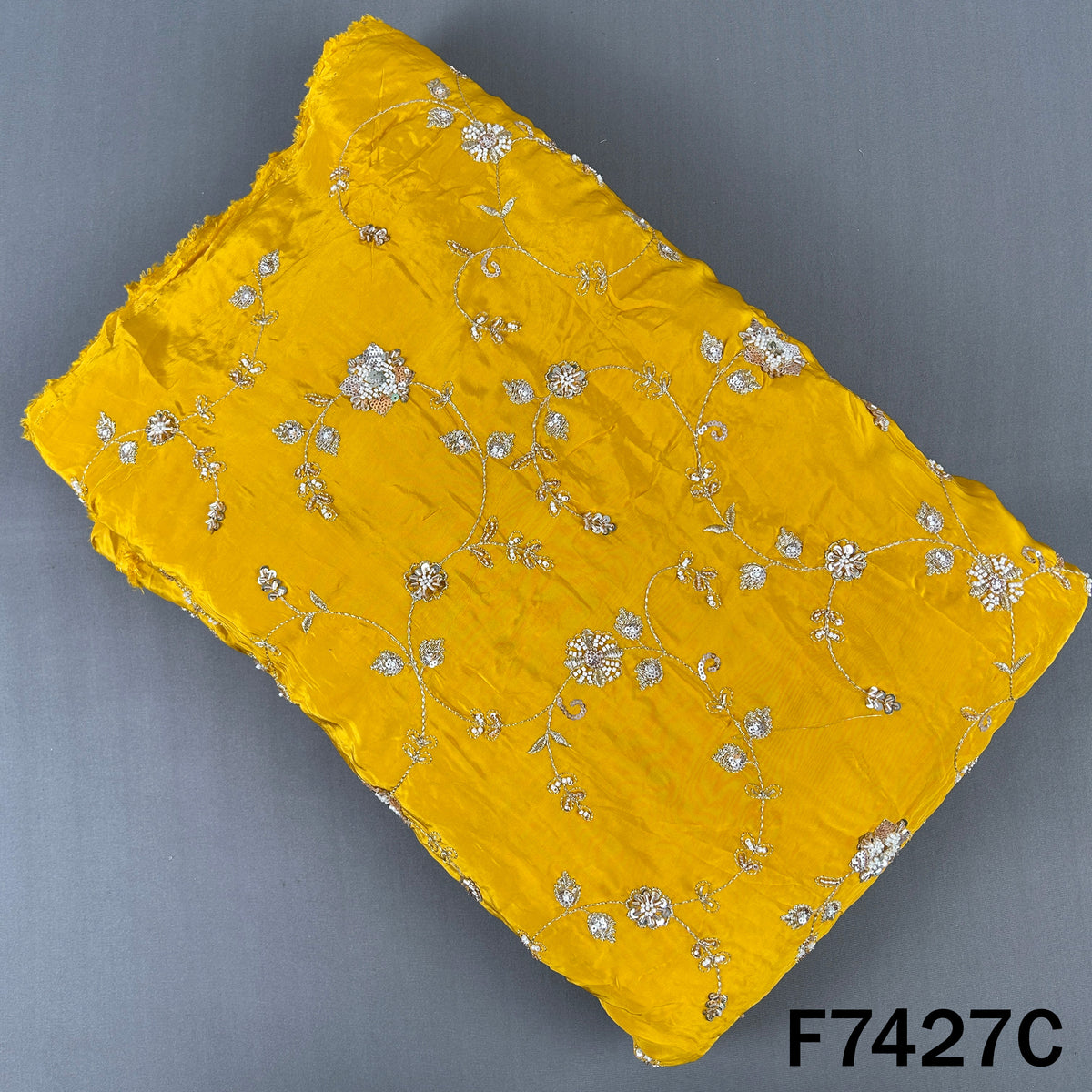 Yellow crepe fabric featuring zari sequin floral vines
