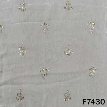 White georgette fabric with spaced metallic embroidered motifs