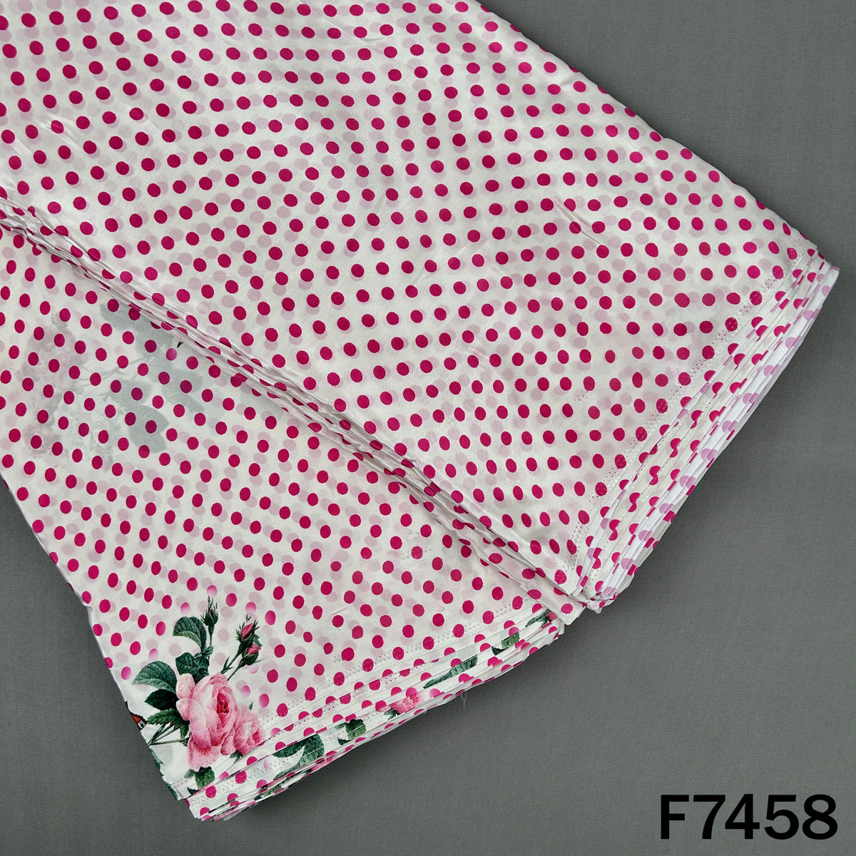 Pink polka dot crepe fabric with floral print