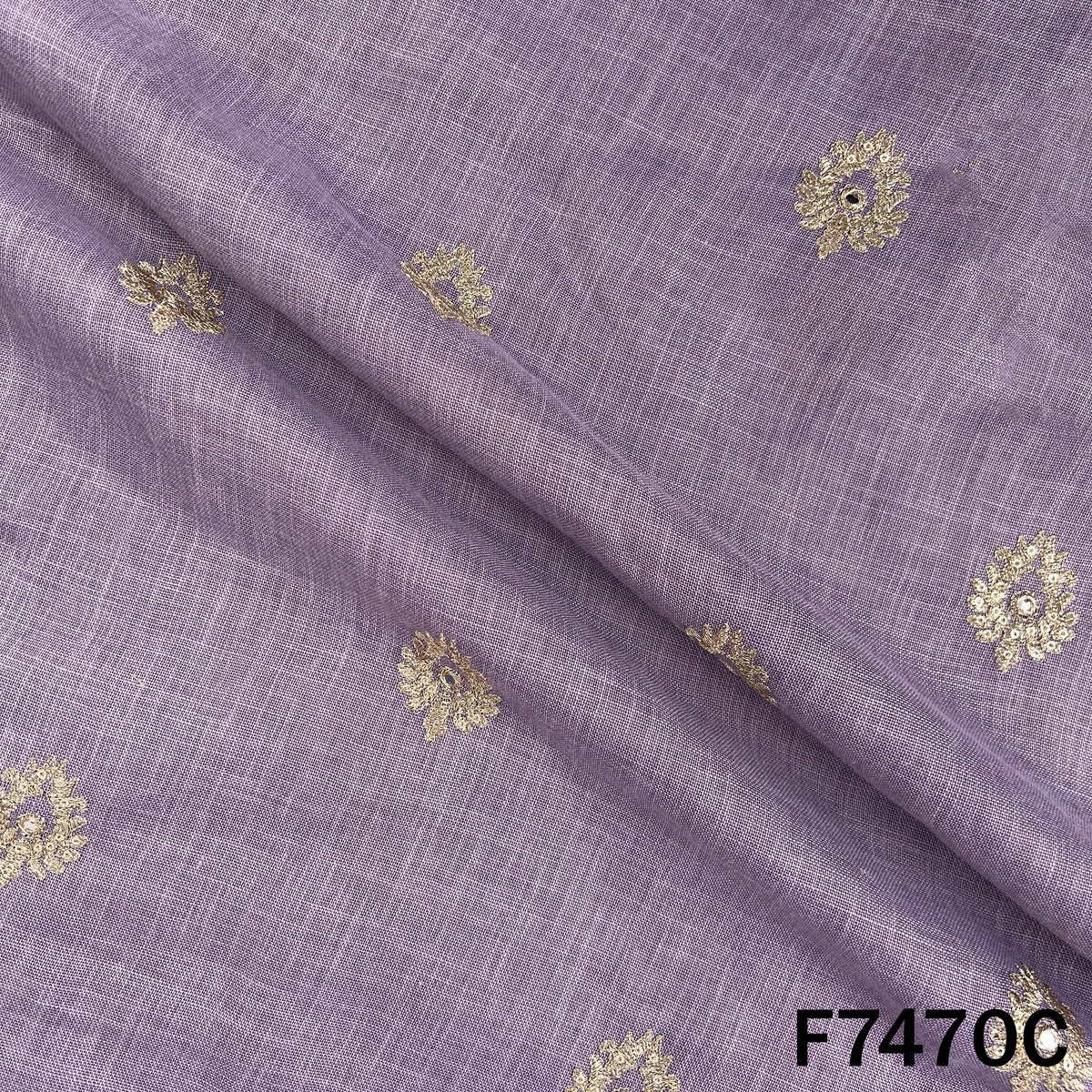 Lavender designer suit fabric with scattered metallic motifs