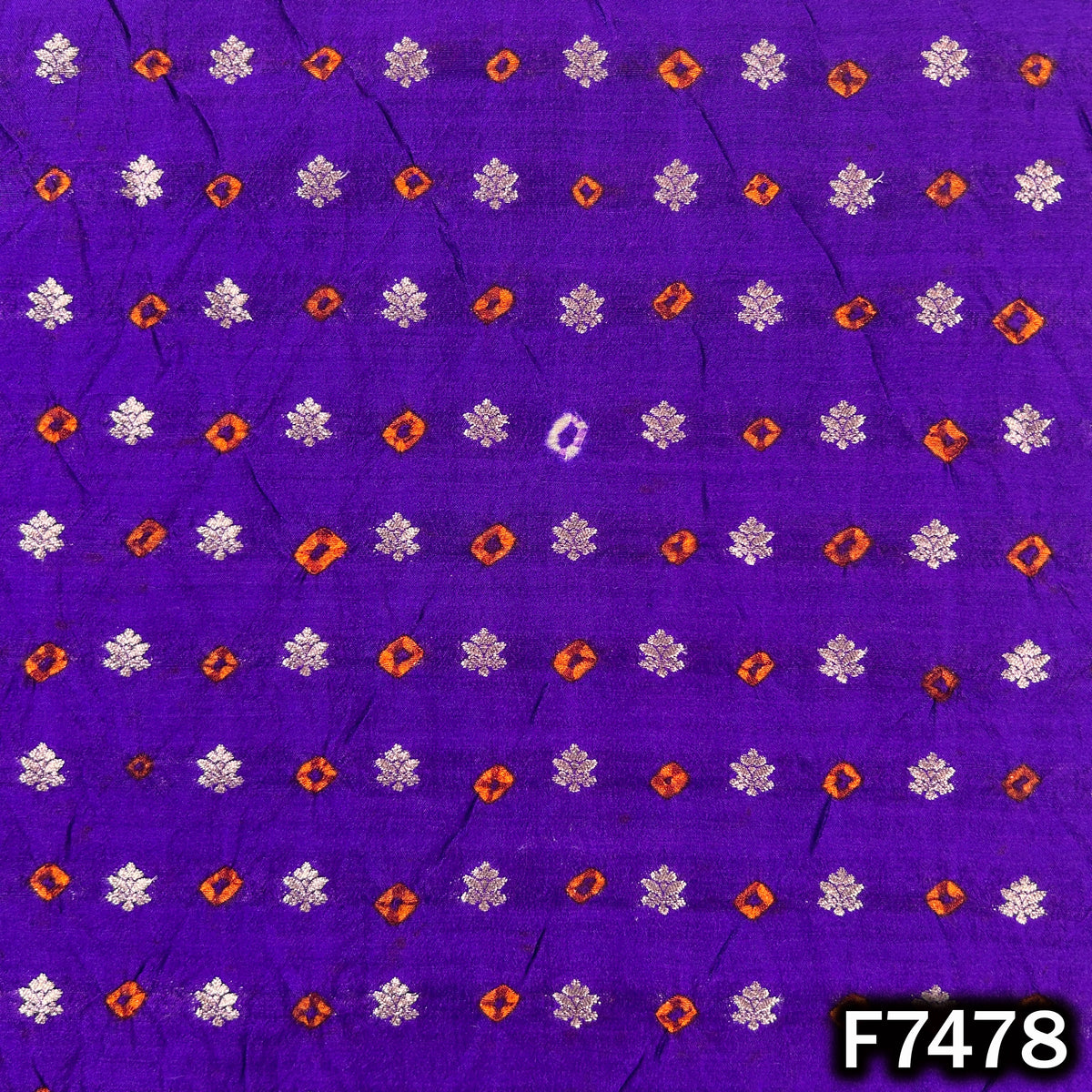 Purple silk fabric with metallic Bandhani zari pattern