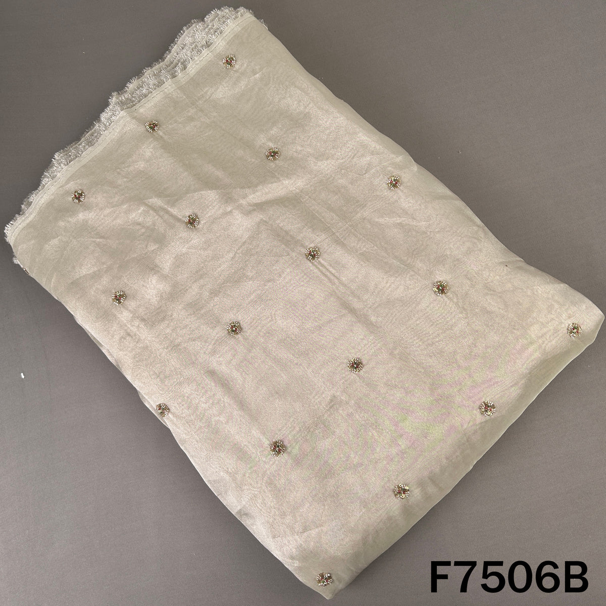 Ivory shimmer tissue bottom with scattered zari motifs