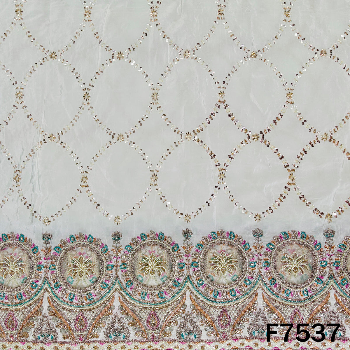 Ivory designer crepe fabric with ornamental embroidered border