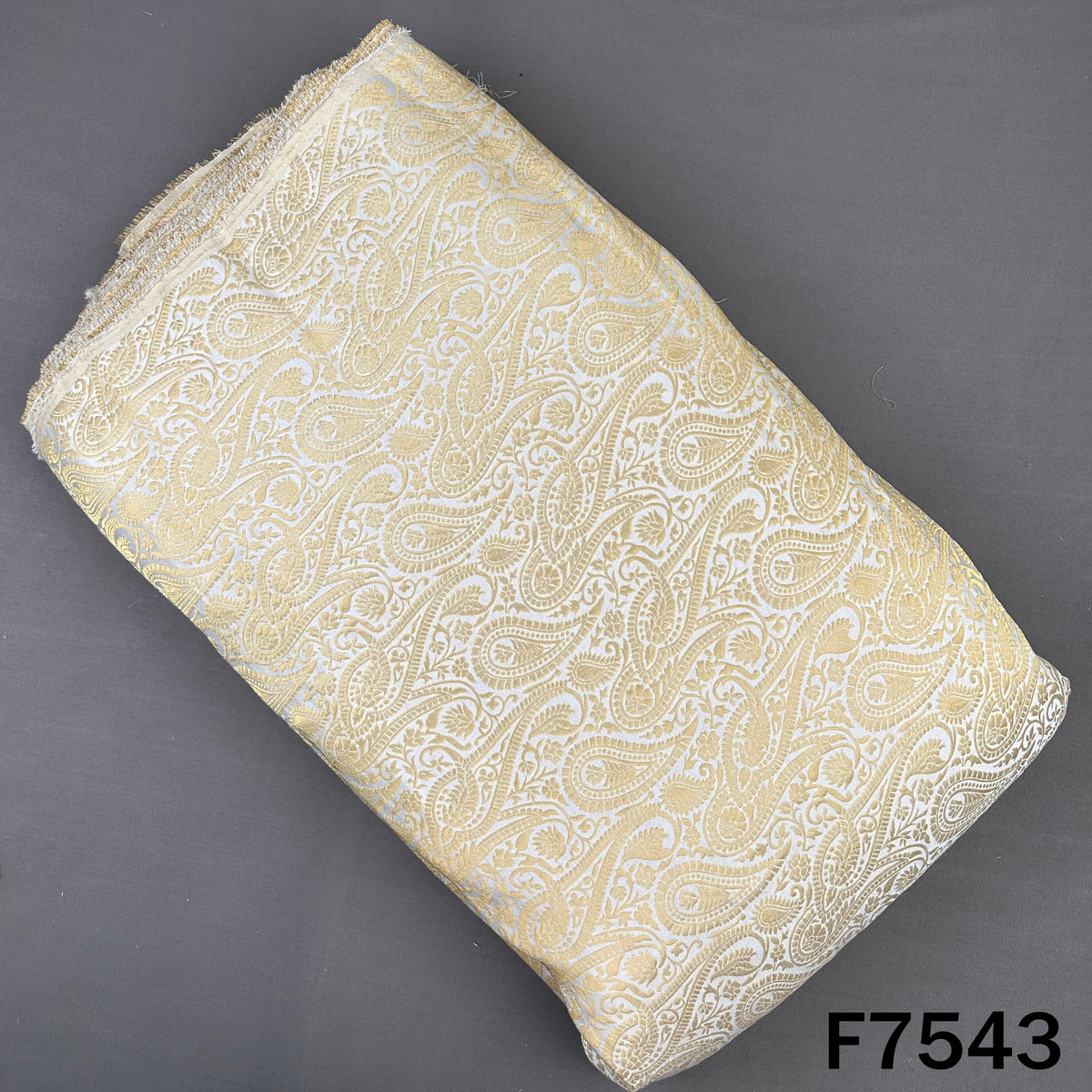 Ivory brocade silk fabric with golden paisley zari