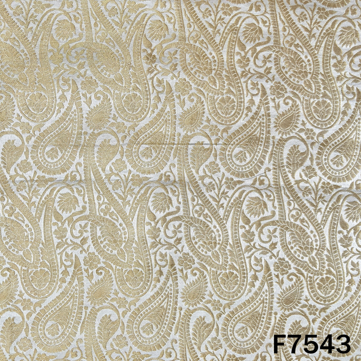 Dyeable brocade silk featuring intricate golden paisley weaving