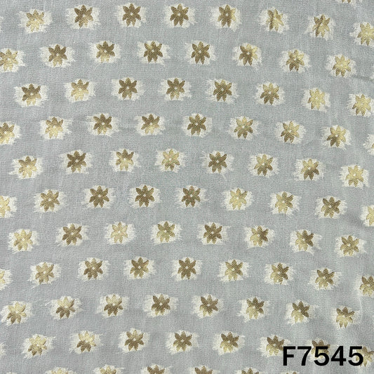 Dyeable georgette suit material featuring golden floral motifs