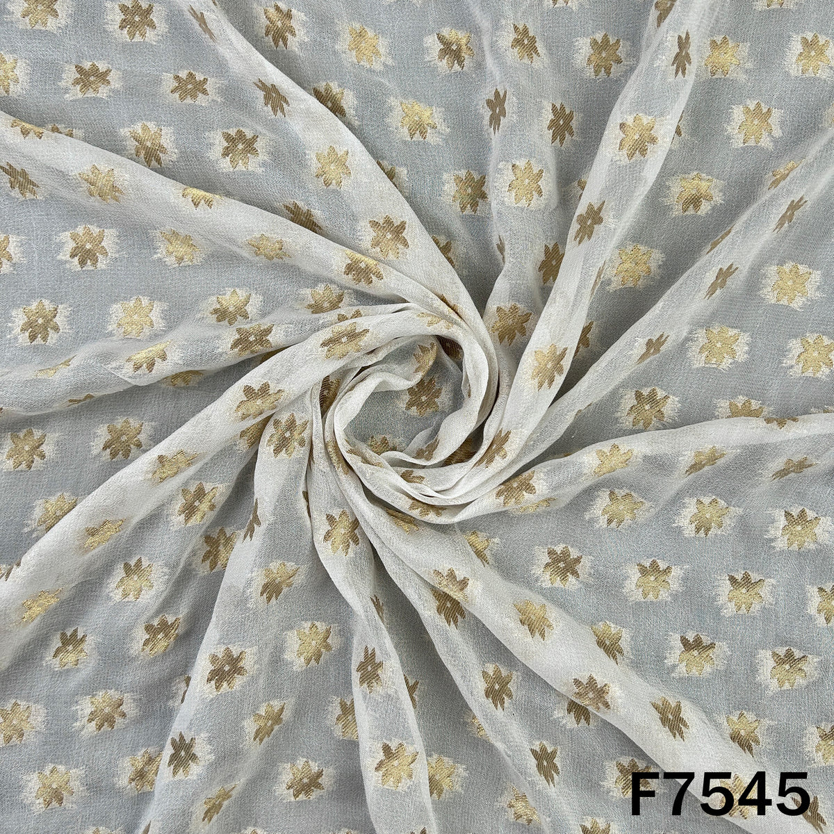 Sheer white georgette fabric with patterned zari weaving