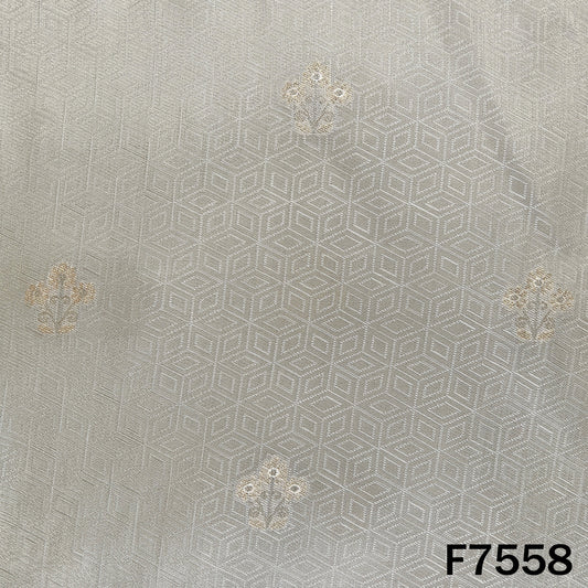 Dyeable jacquard tissue fabric featuring delicate golden floral butis