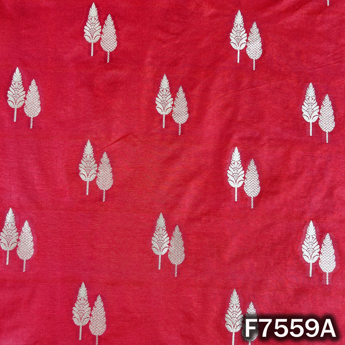 Traditional red silk brocade with scattered zari leaves