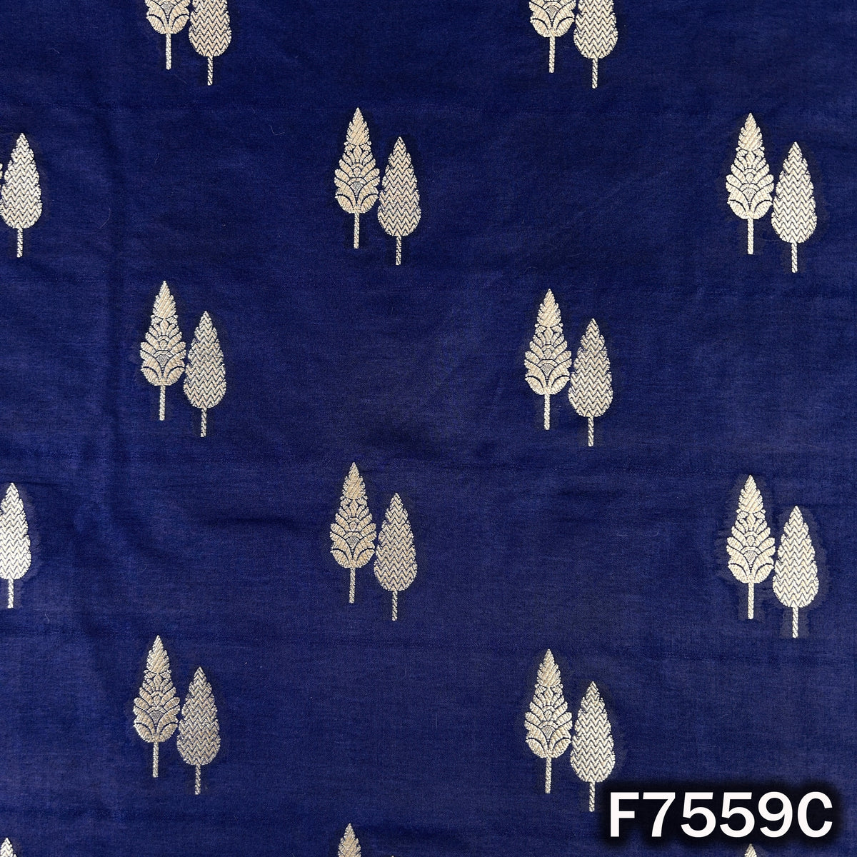 Dark blue zari brocade displaying silver leaf pattern