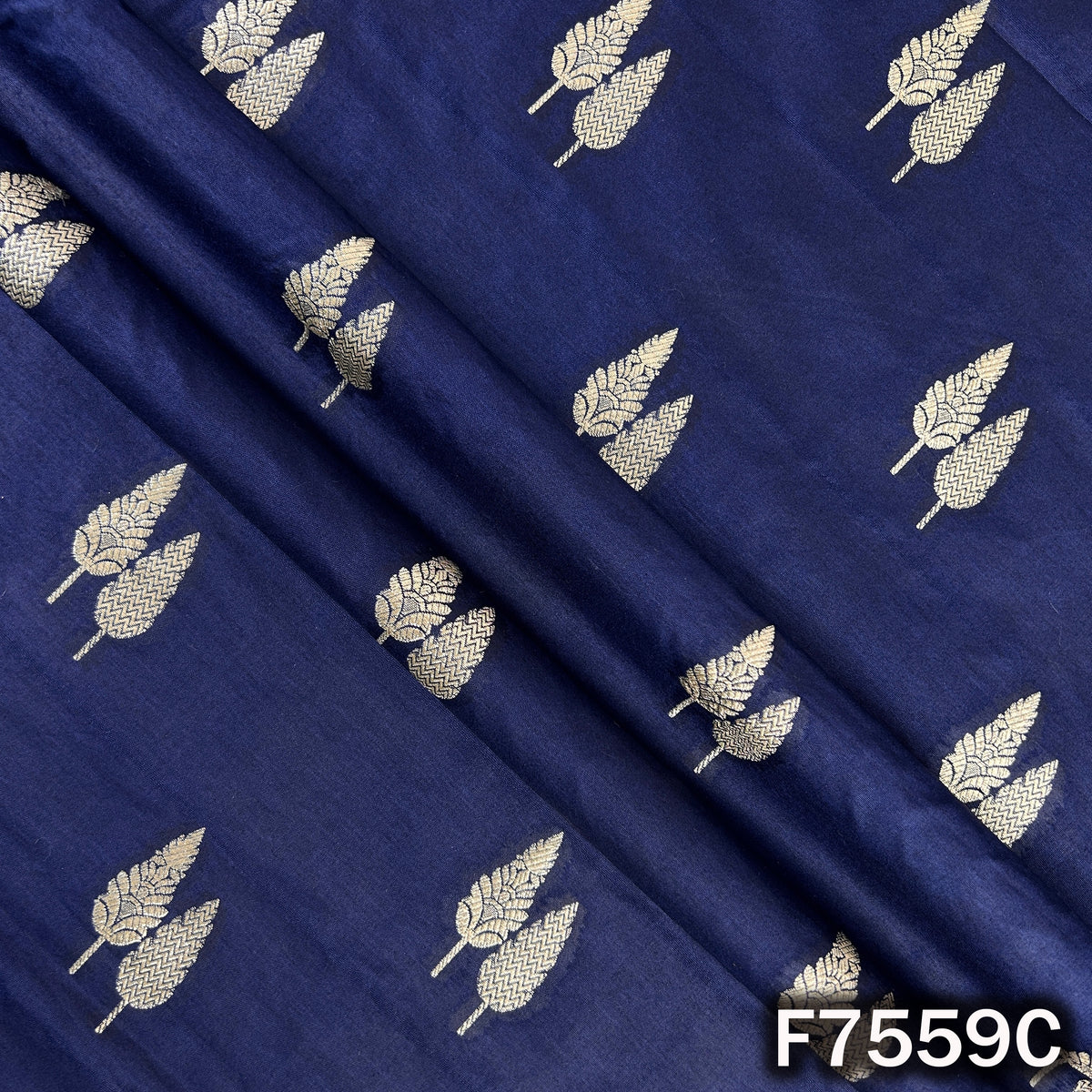 Flowing navy brocade silk with repeated woven foliage