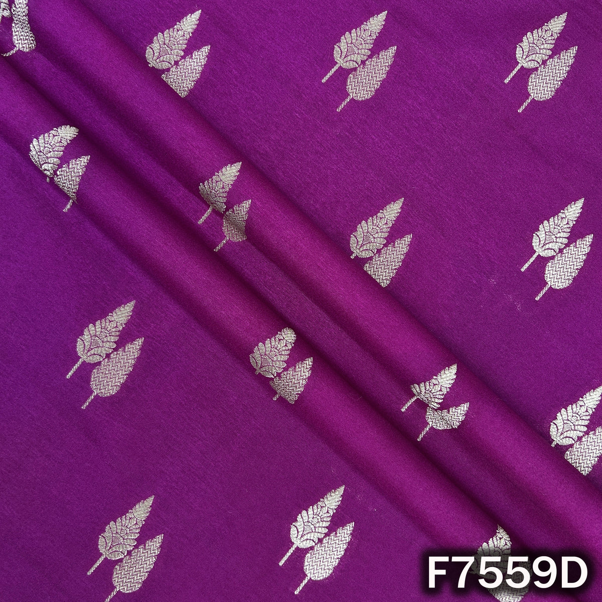 Draped purple brocade silk showcasing delicate zari motifs