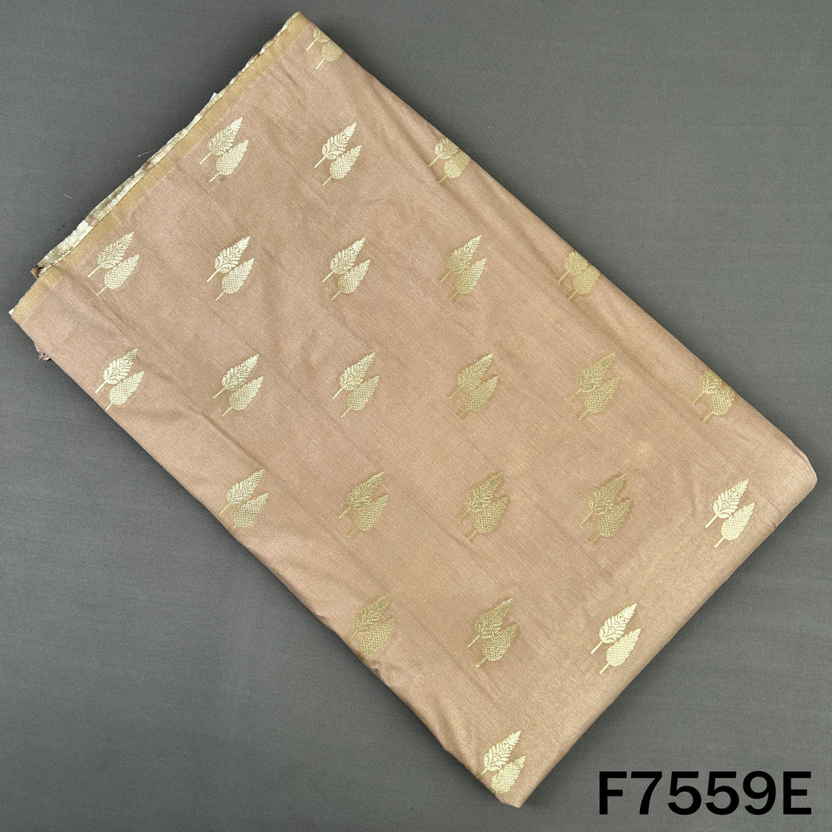 Beige brocade silk fabric with subtle metallic leaves