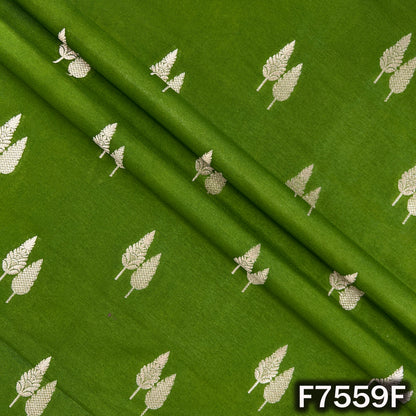 Draped green silk brocade revealing scattered zari foliage