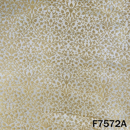 Dyeable gold brocade silk with dense leafy motifs