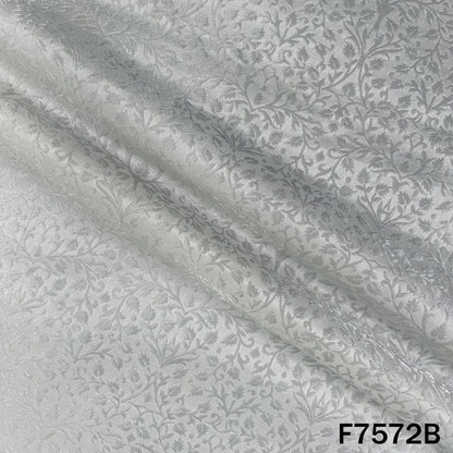 Dyeable silver brocade fabric featuring shimmering leafy weave