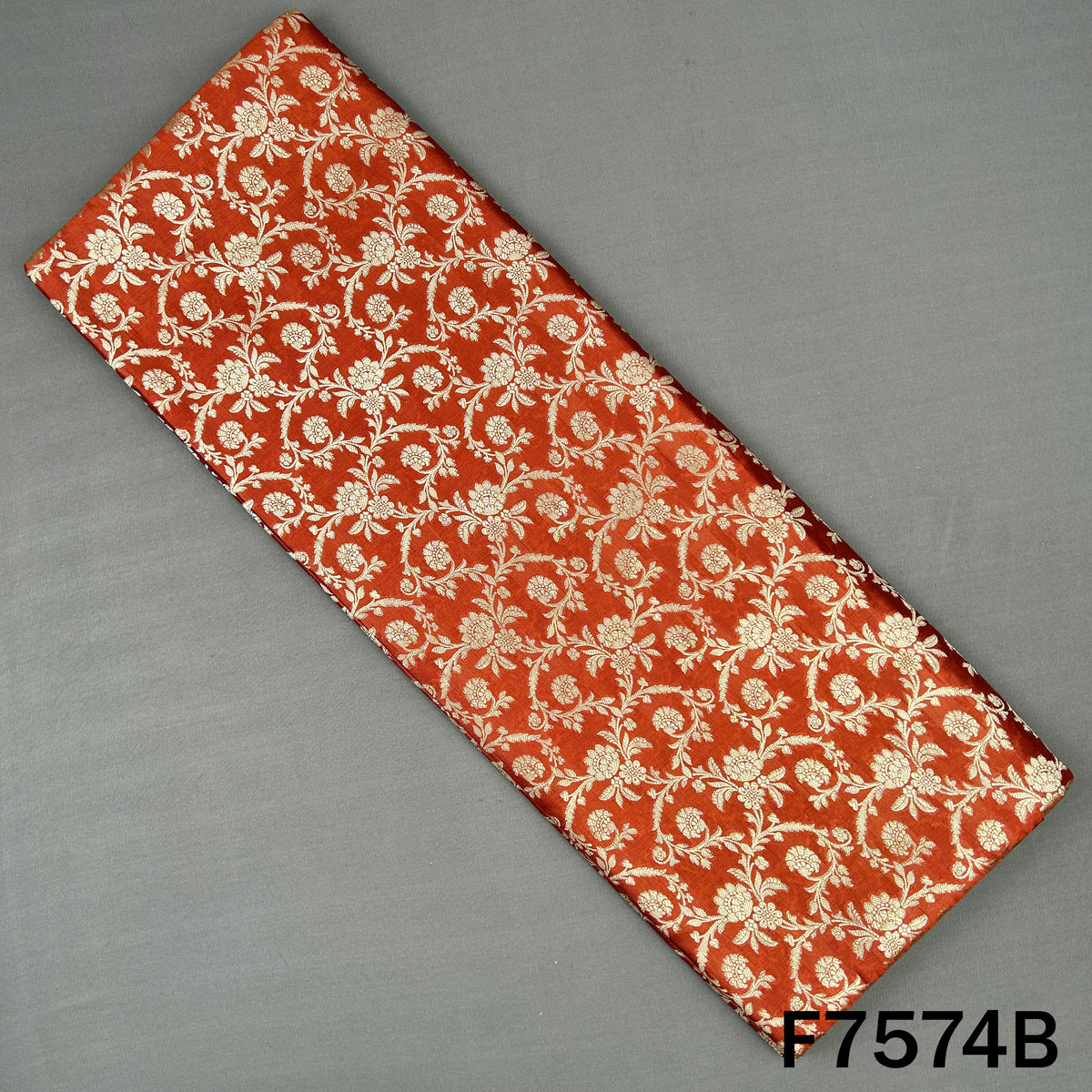 Orange Banarasi brocade silk with golden floral motifs