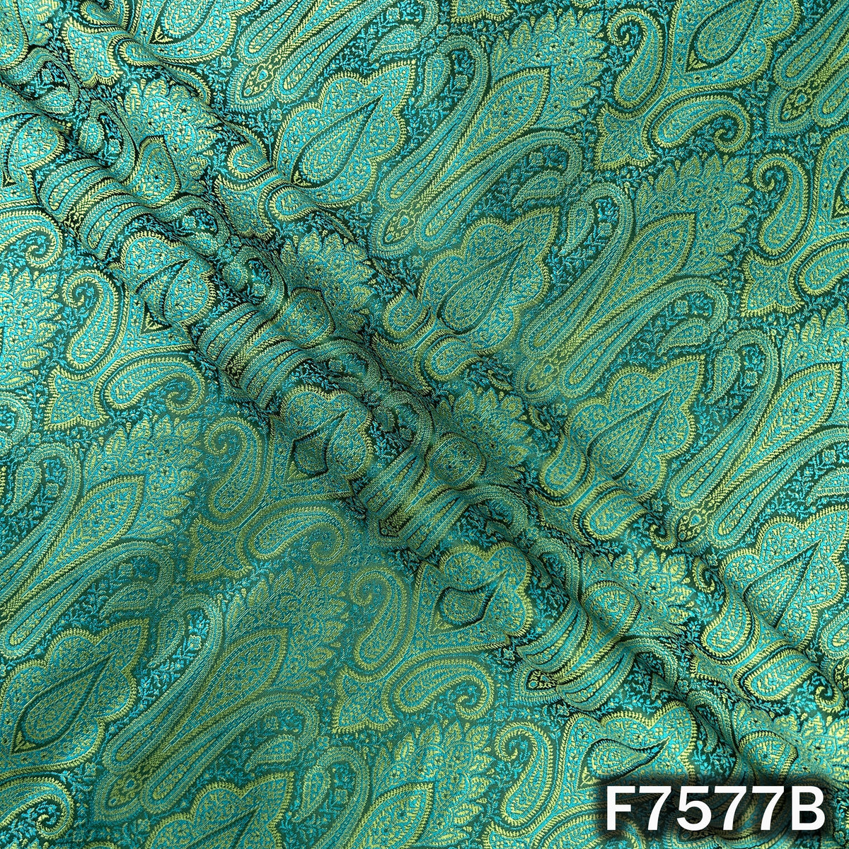 Draped turquoise green brocade with woven paisley pattern