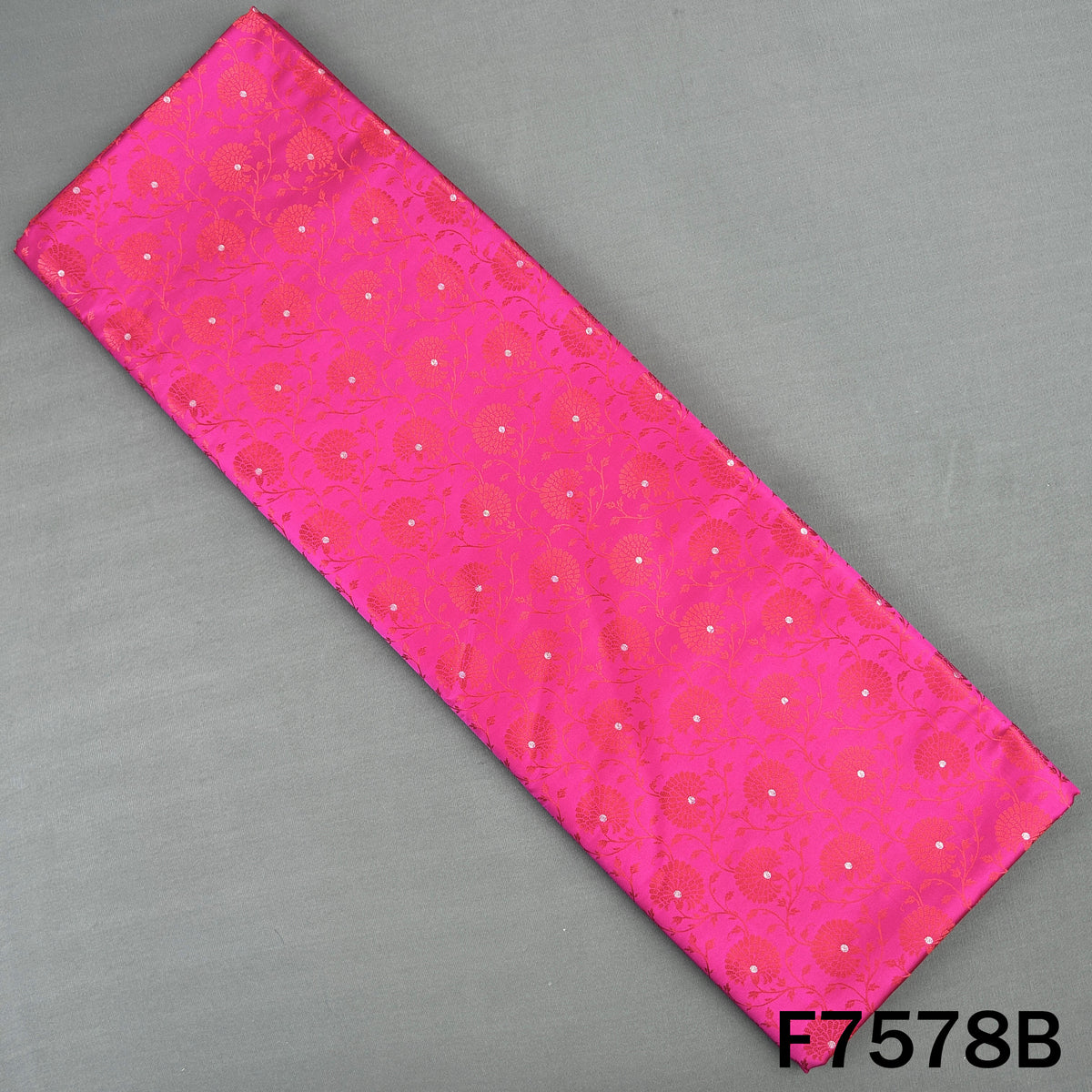 Rani pink brocade fabric with floral vine motifs