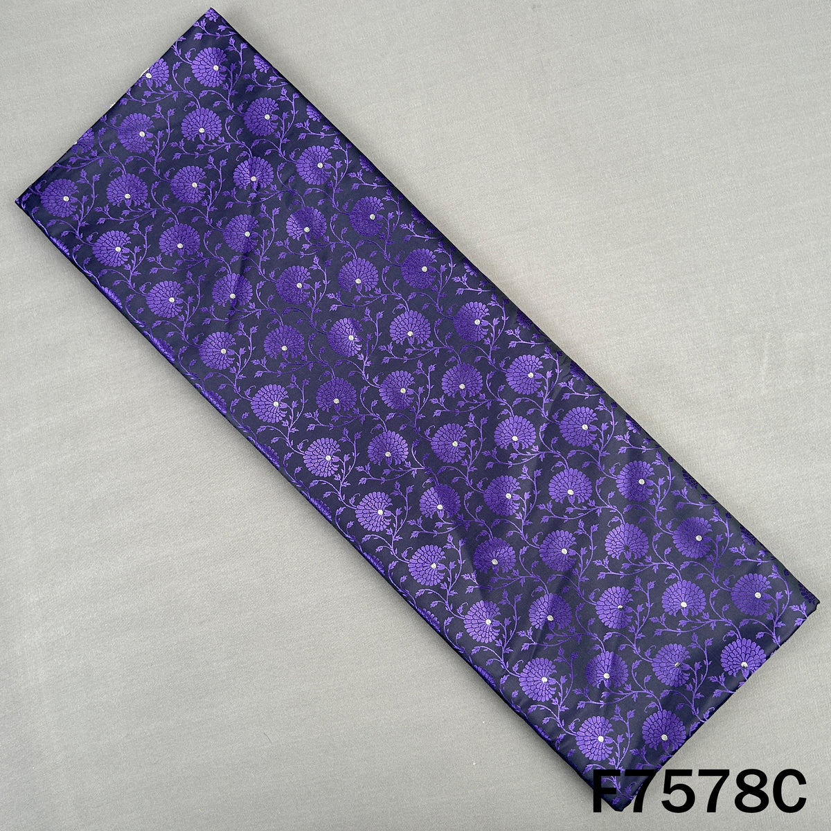 Dark purple brocade fabric with floral jacquard motifs