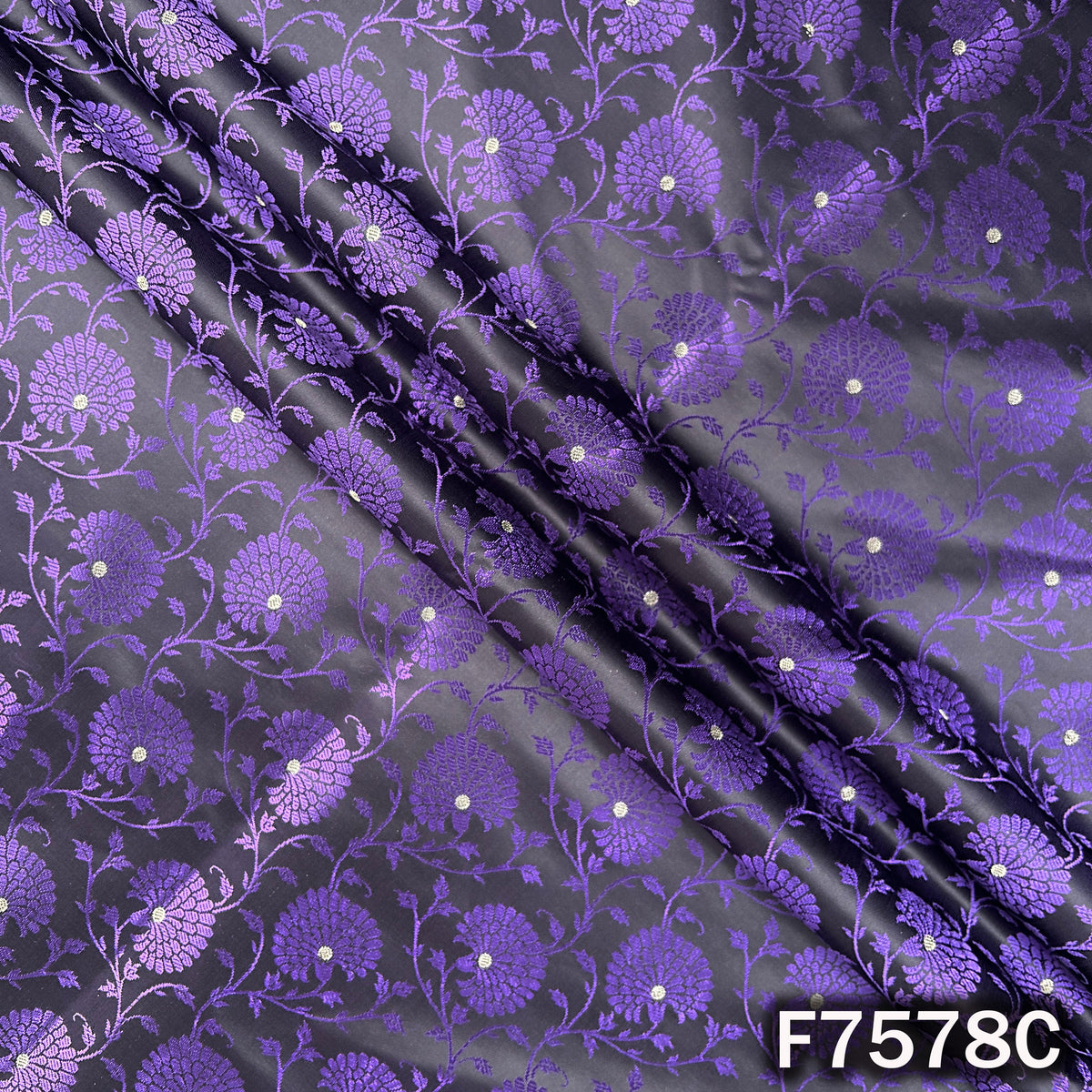Draped purple designer brocade with woven floral vines